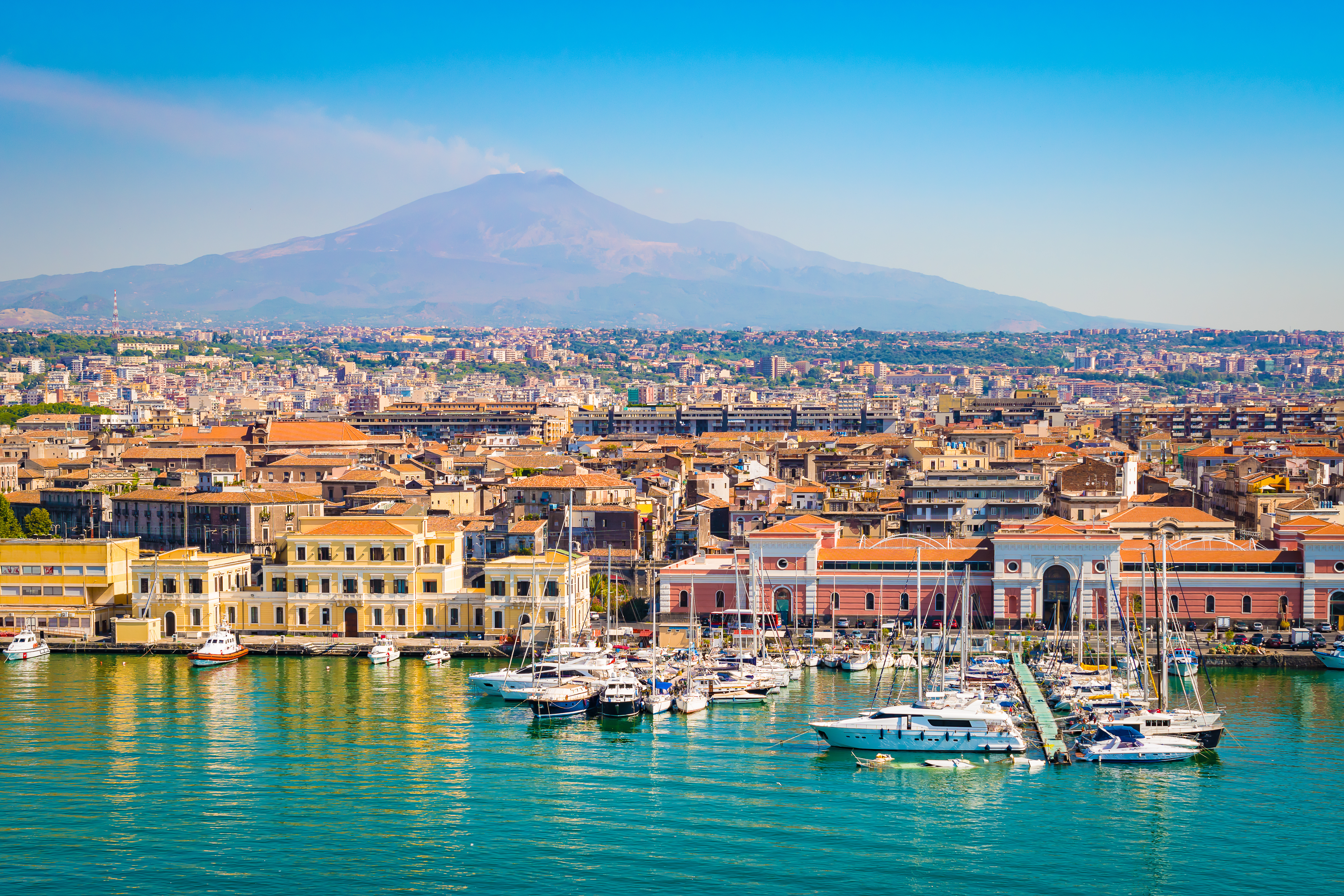 Boats in the Harbour of Catania, Italy, with the Mount Etna in the background