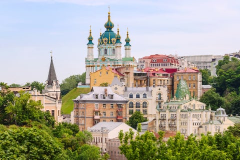 Aerial view of Kiev, Ukraine, featuring Saint Sophia’s Cathedral, other historic buildings, and bustling city life