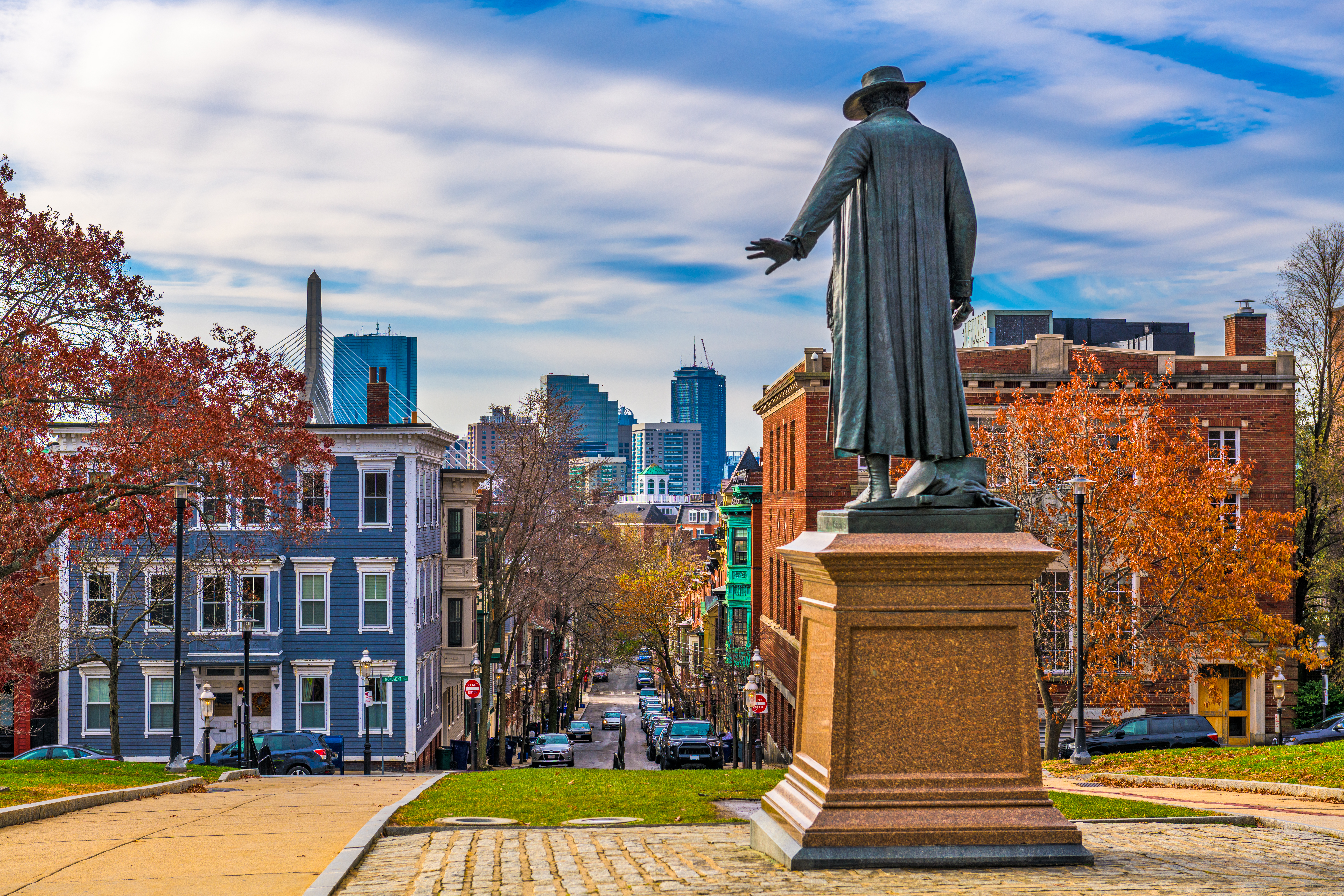 Back view of Colonel William Prescott statue at Bunker Hill Monument in Boston, Massachusetts, with colorful autumn foliage
