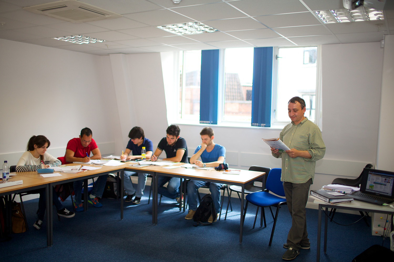 A group of students in class with their teacher