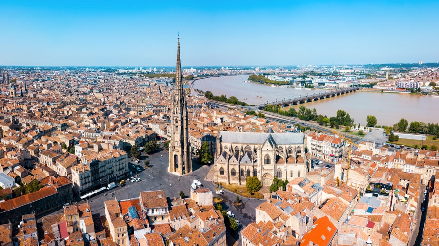 Aerial view of Bordeaux City Center featuring Bordeaux Cathedral, officially known as Cathédrale Saint-André de Bordeaux and Garonne River, France