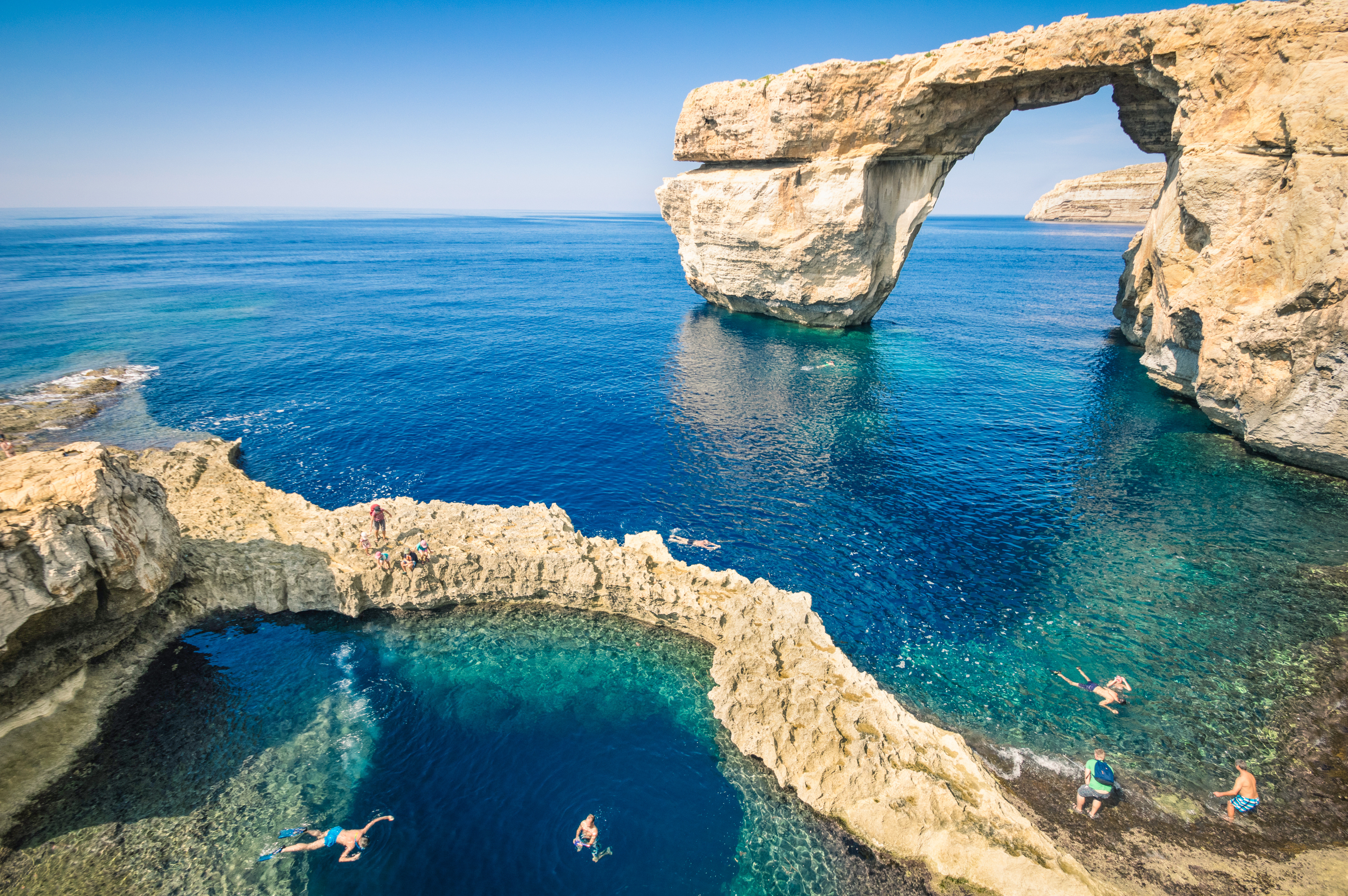Salina Bay Malta natural rock sea pools with crystal-clear water and coastal landscape