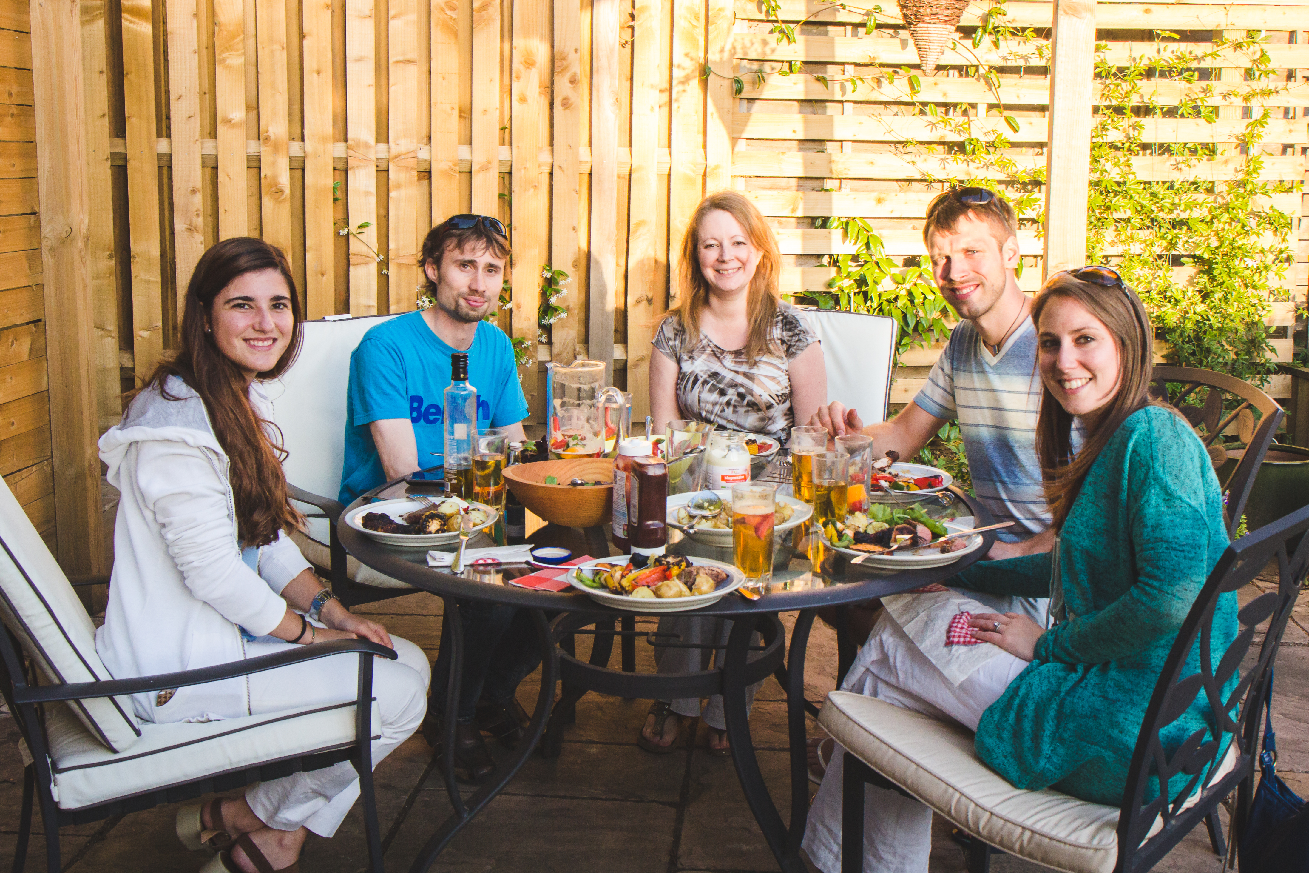 A student having a meal with the teacher's family
