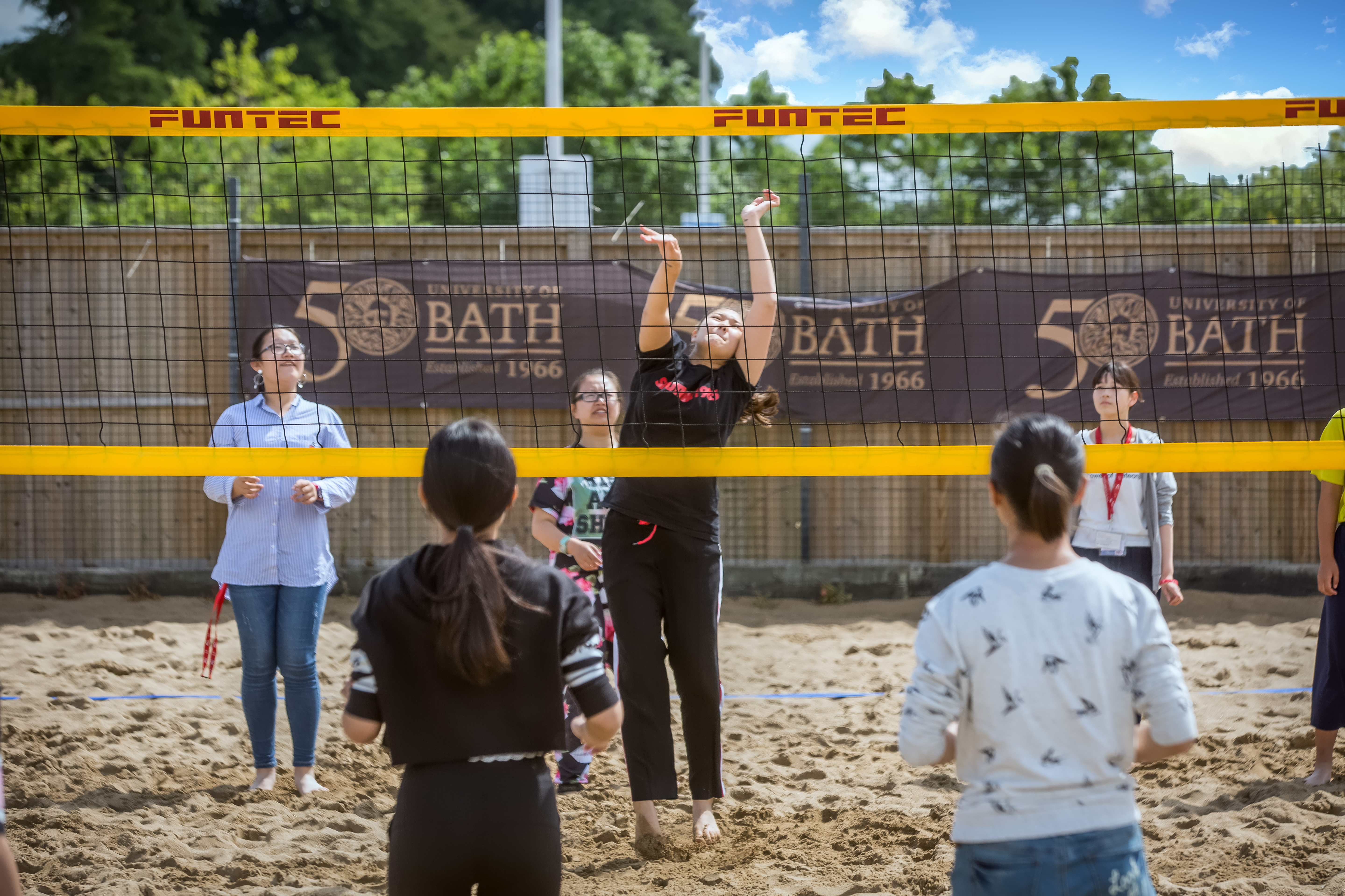 Students playing beach volley