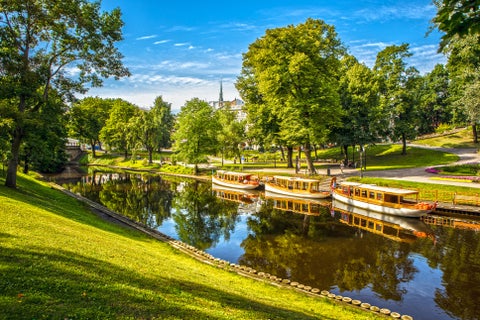 Boats in Riga City Canal which flows through the Bastejkalns Park and encircles Riga’s Old Town