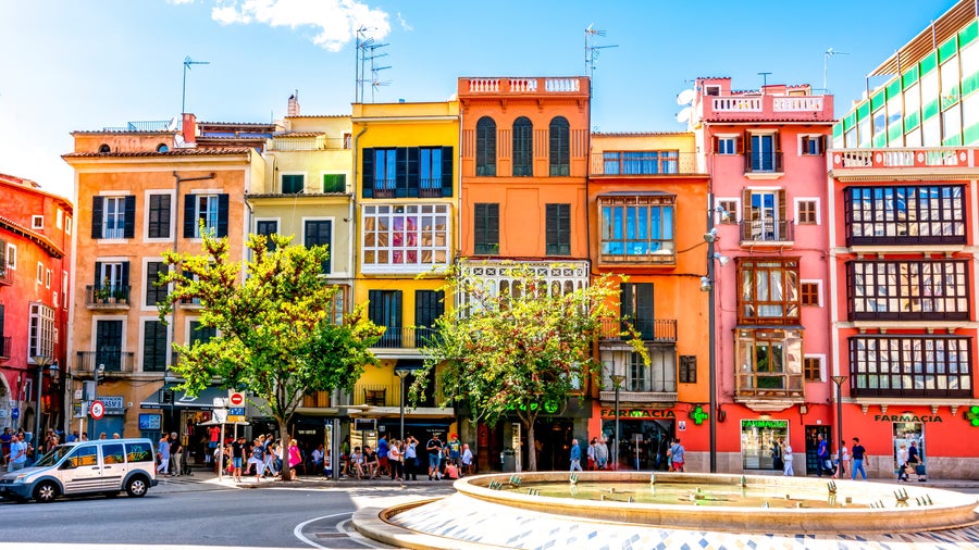 City center of Palma de Mallorca, Spain, featuring colorful buildings with traditional shutters and balconies