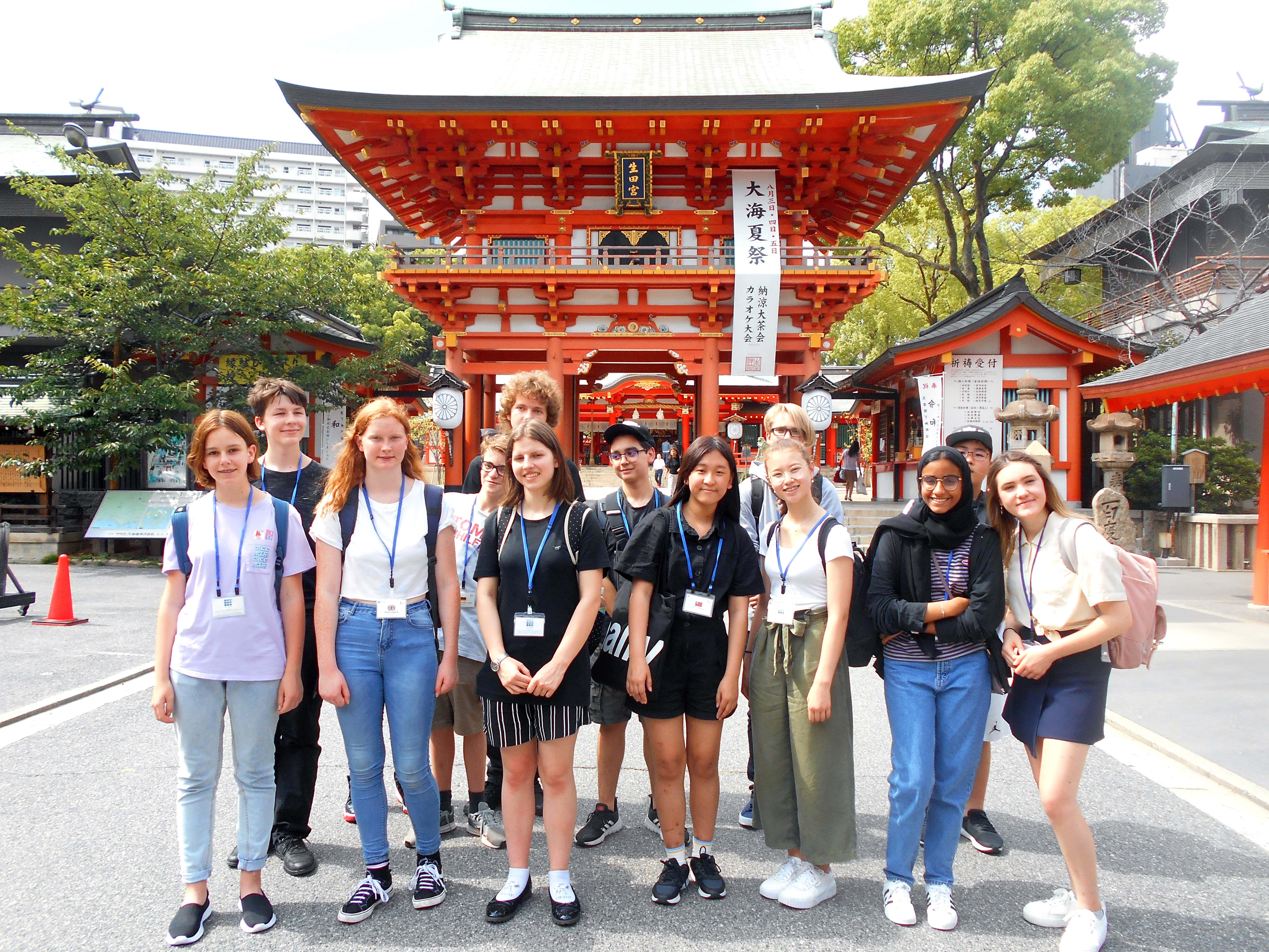 A group of students in front of a temple in Kobe