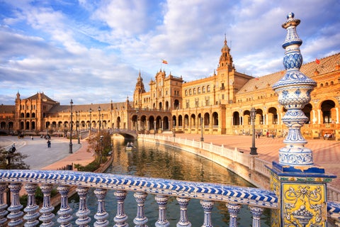 Blue azulejos-tiled bridge at Plaza de España, a famous landmark in Seville, Andalusia, Spain