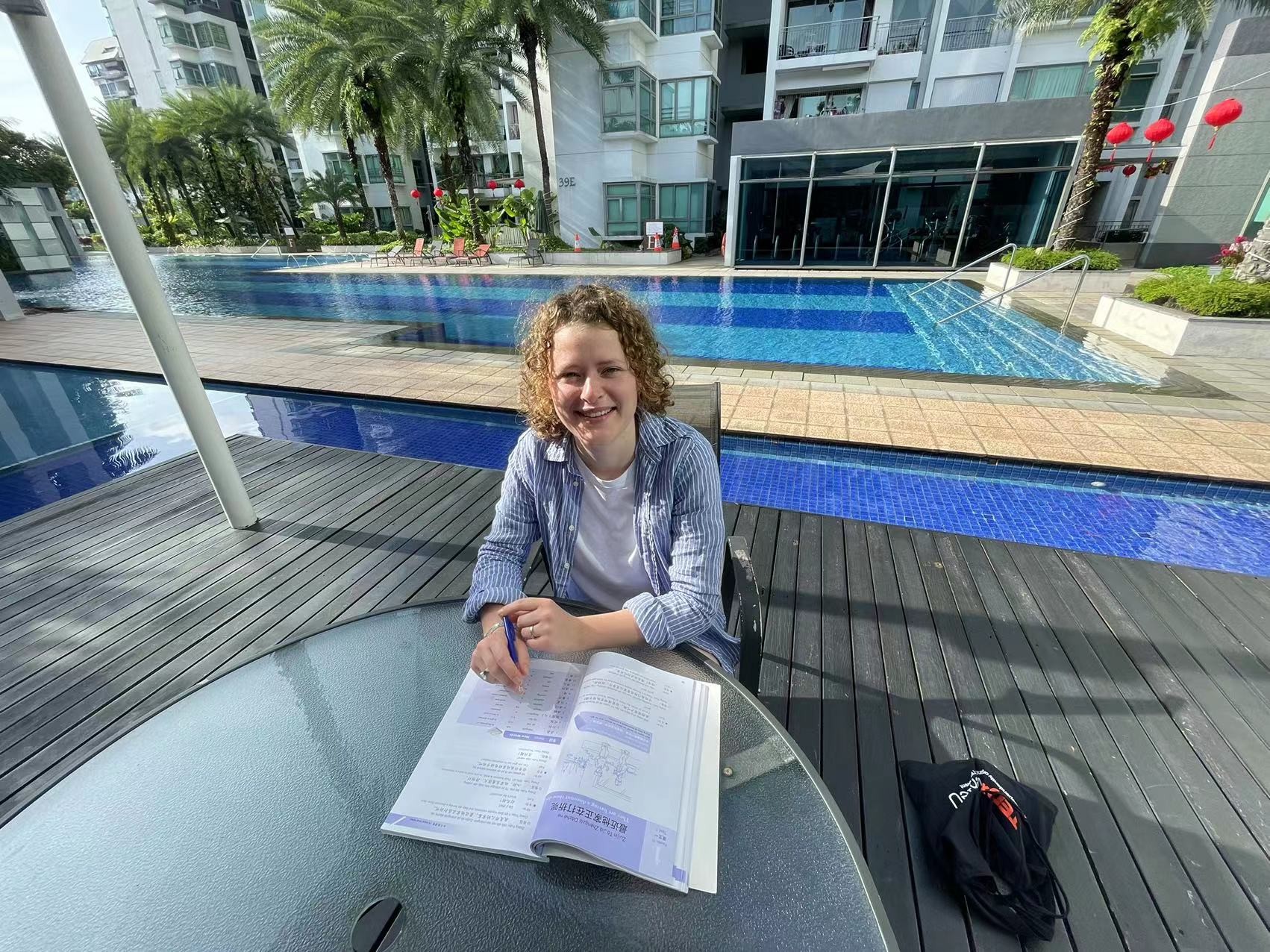 A student by the pool at LTL Singapore
