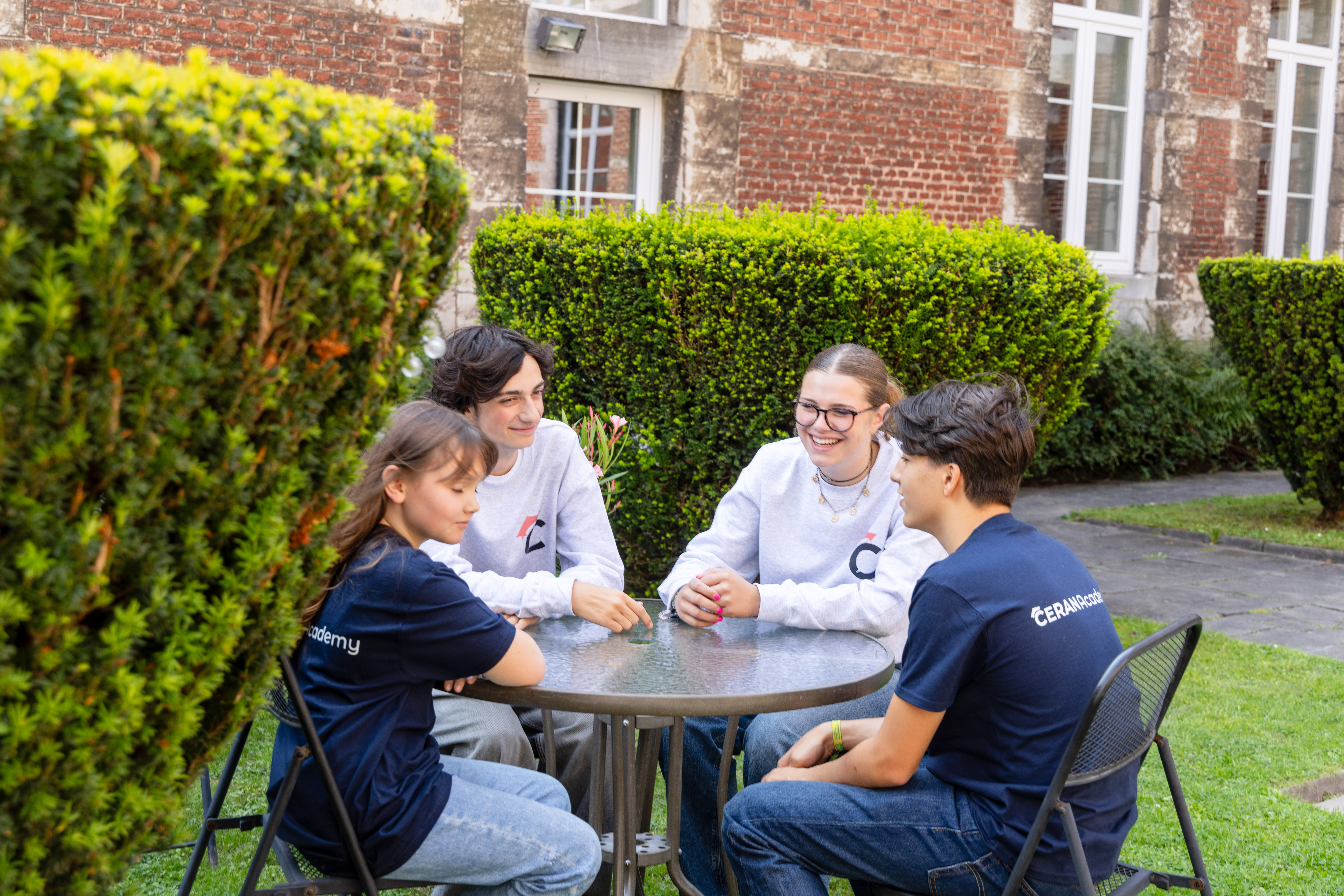 School garden with students around the table