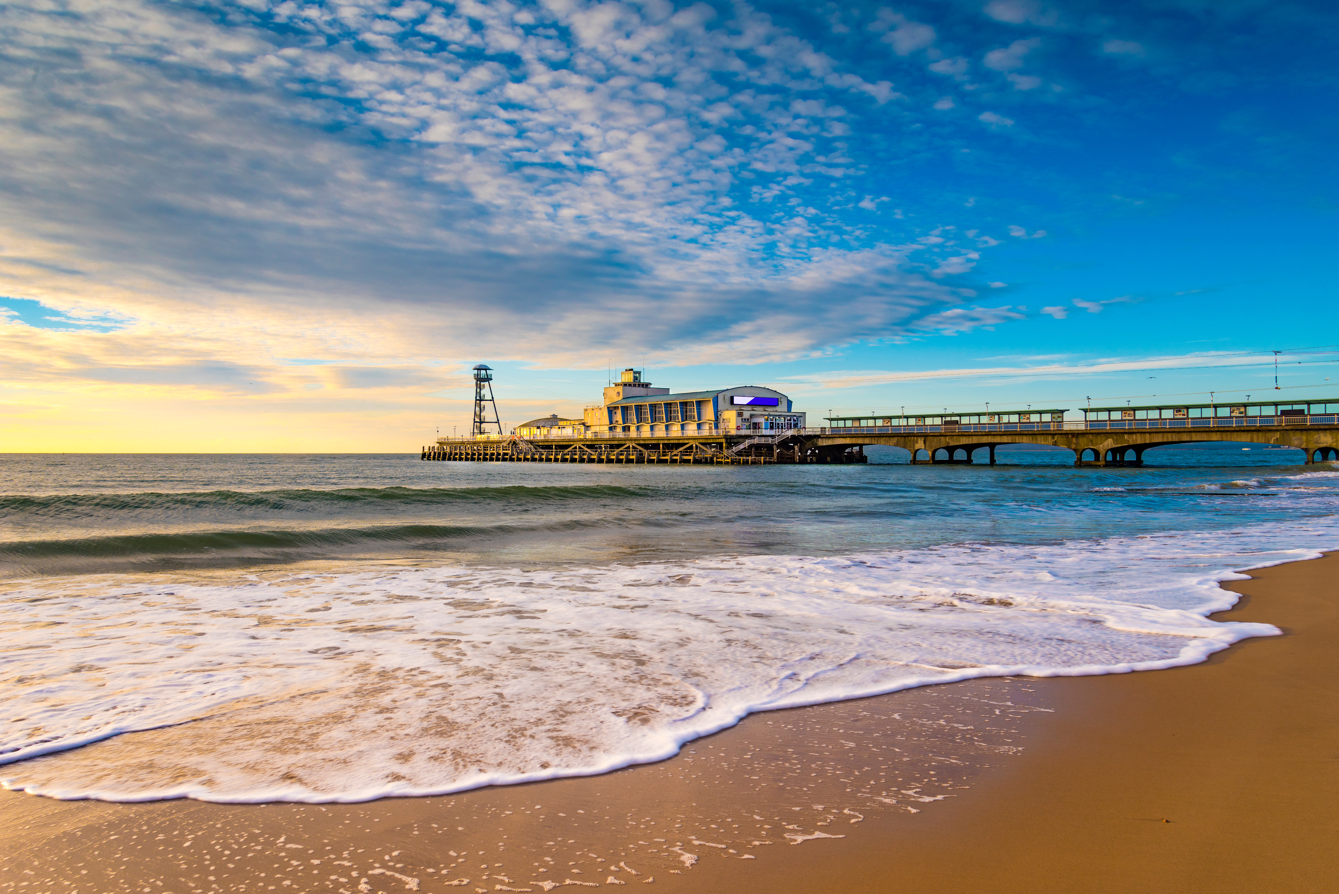 Bournemouth Beach and Pier at sunrise, with golden sands and calm waters in the UK