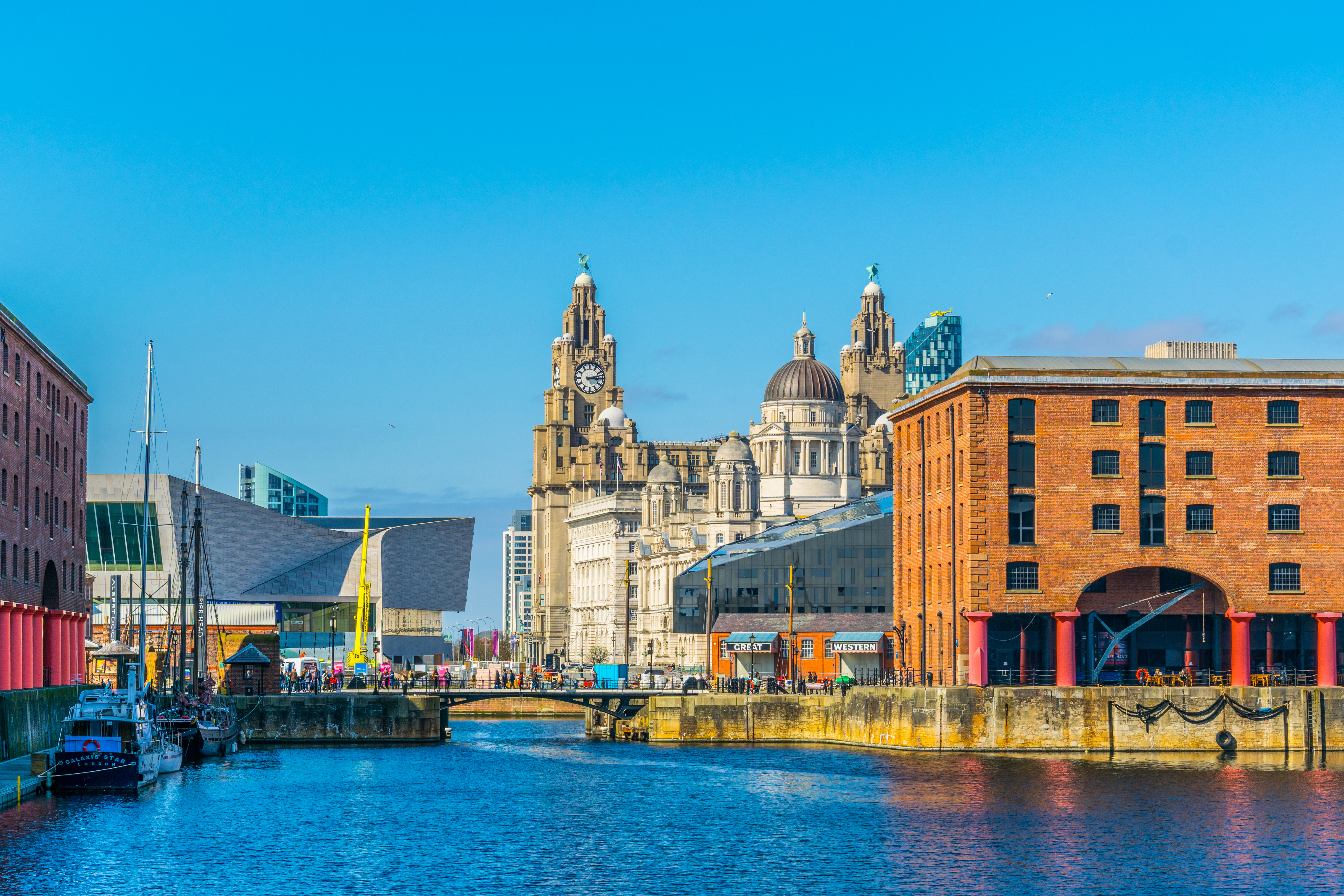 Liverpool skyline through Albert Dock England with waterfront buildings and city landmarks