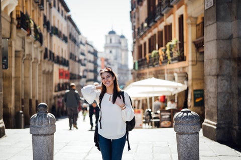 Student posing for a picture on the streets of Madrid city center, Spain