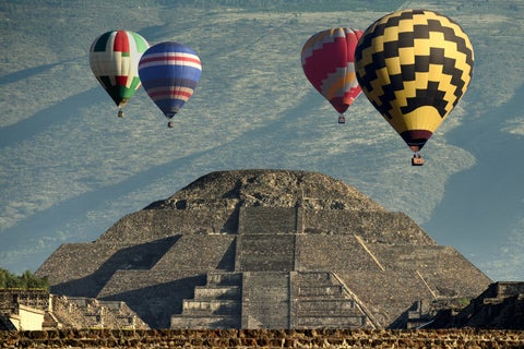 Hot air balloons flying over the Pyramid of the Sun in Teotihuacan, near Mexico City, Mexico