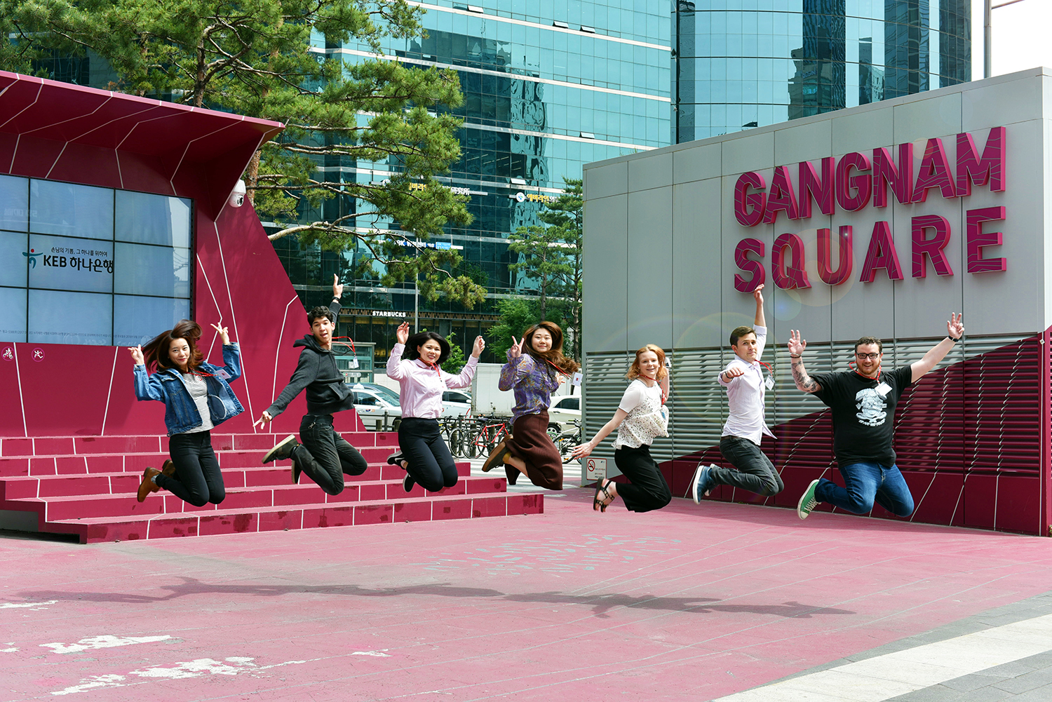 A group of students jumping at Gangnam Square