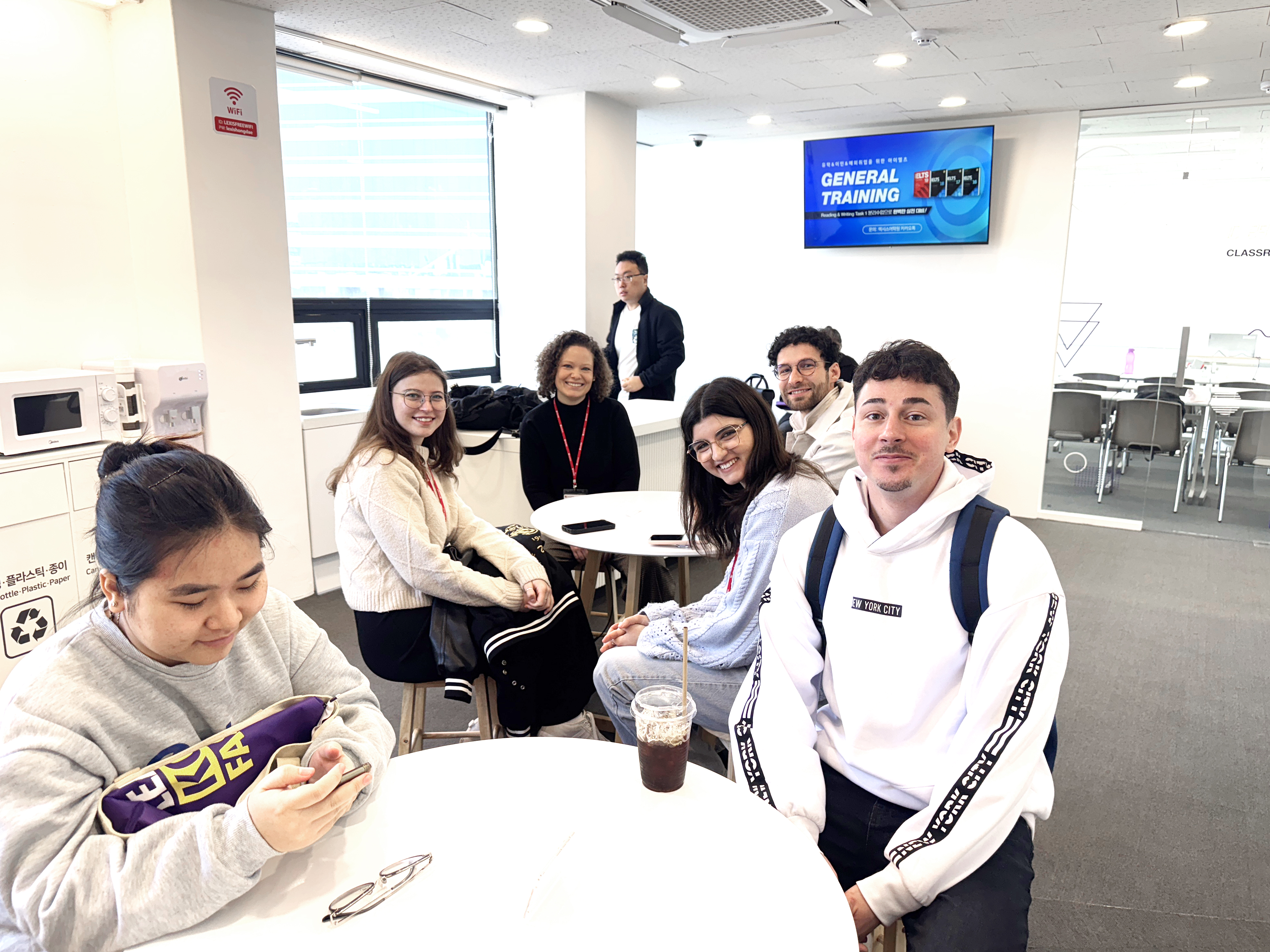 A group of students sitting in the common room