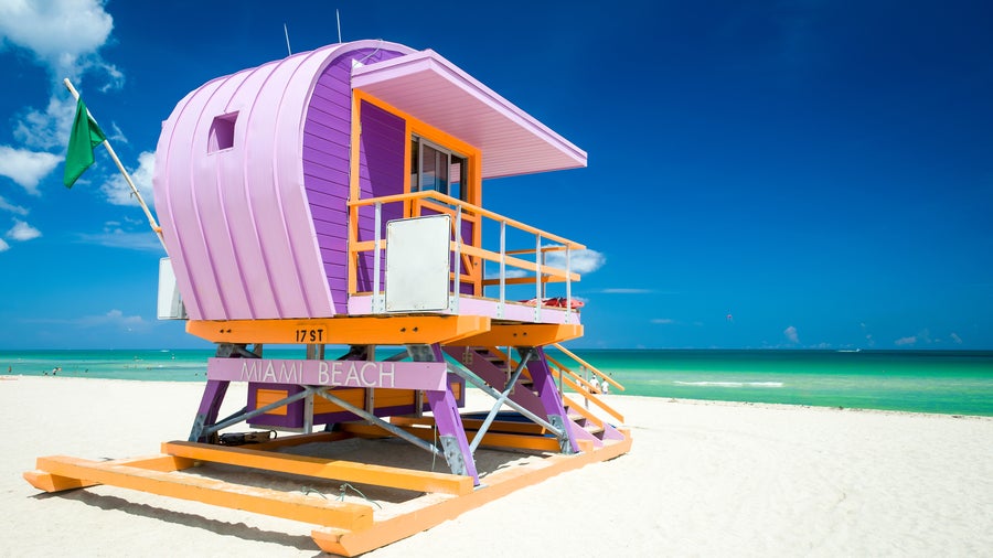 Colourful lifeguard tower on sunny South Beach, Miami Florida, with bright blue sky overhead