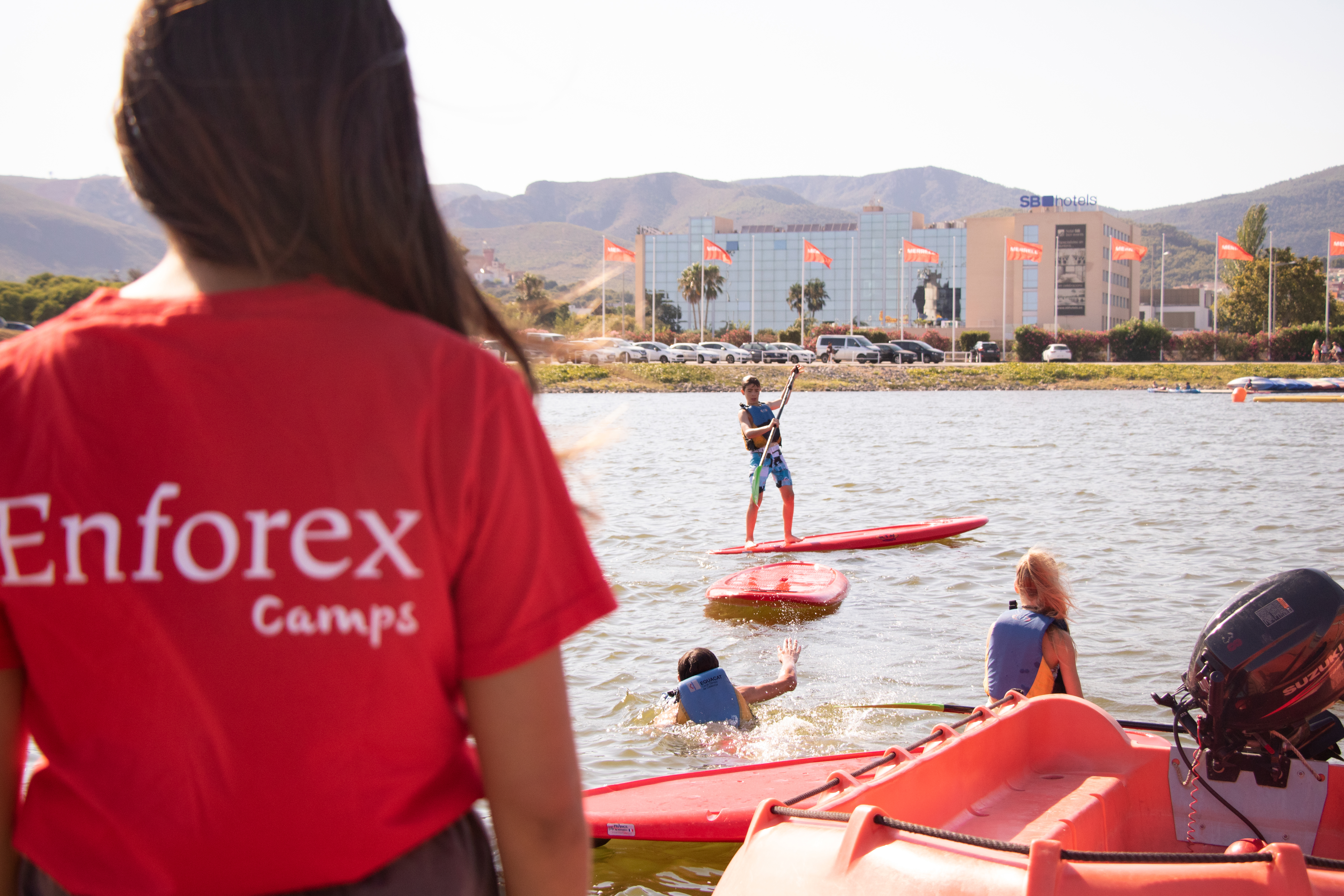Students doing paddle surf