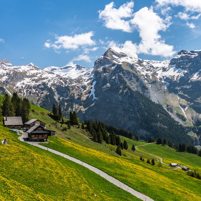 Traditional wooden Swiss chalet in the mountains of Engelberg, Switzerland, surrounded by alpine scenery