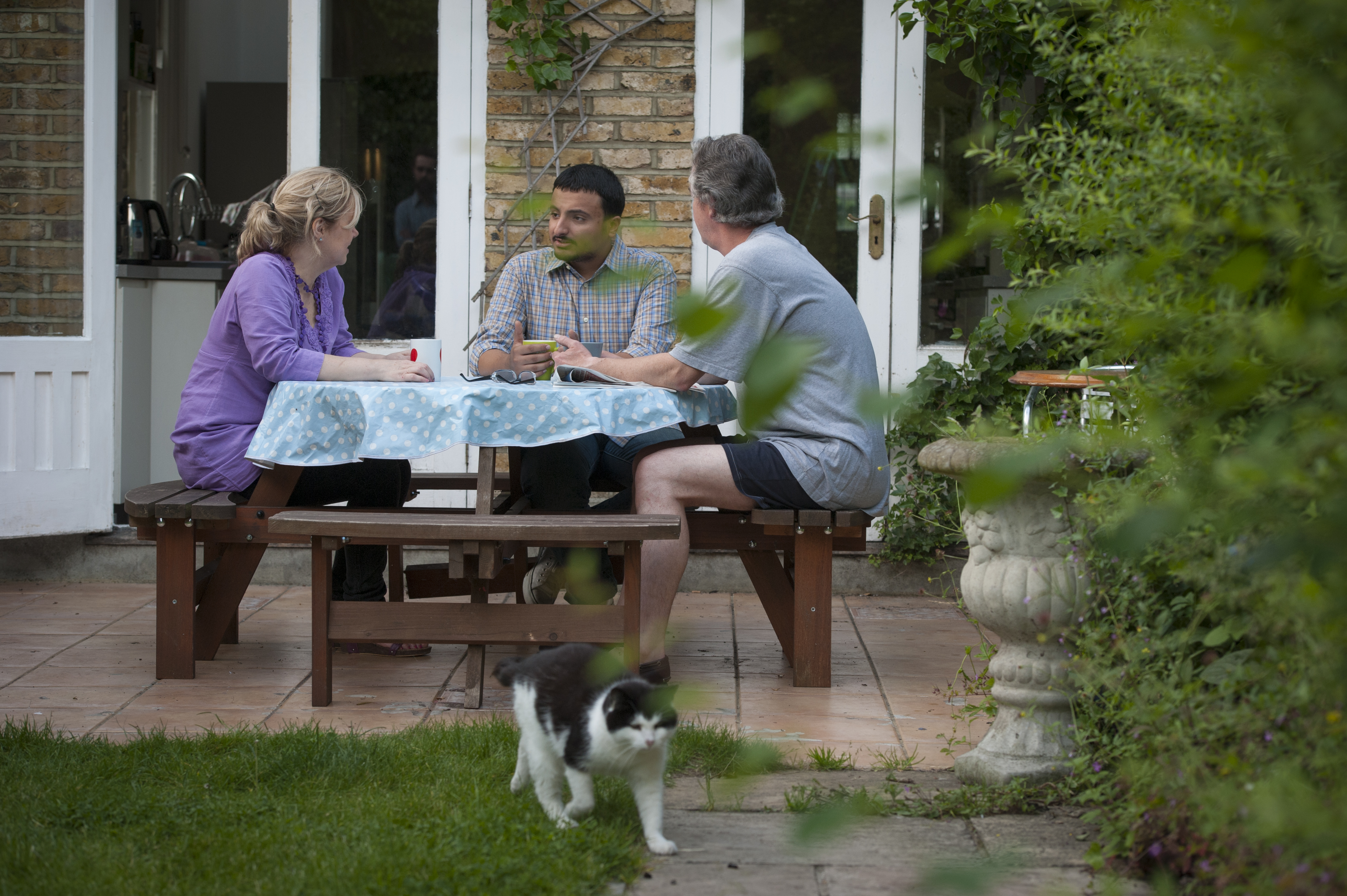 A student spending time with the teacher and the family