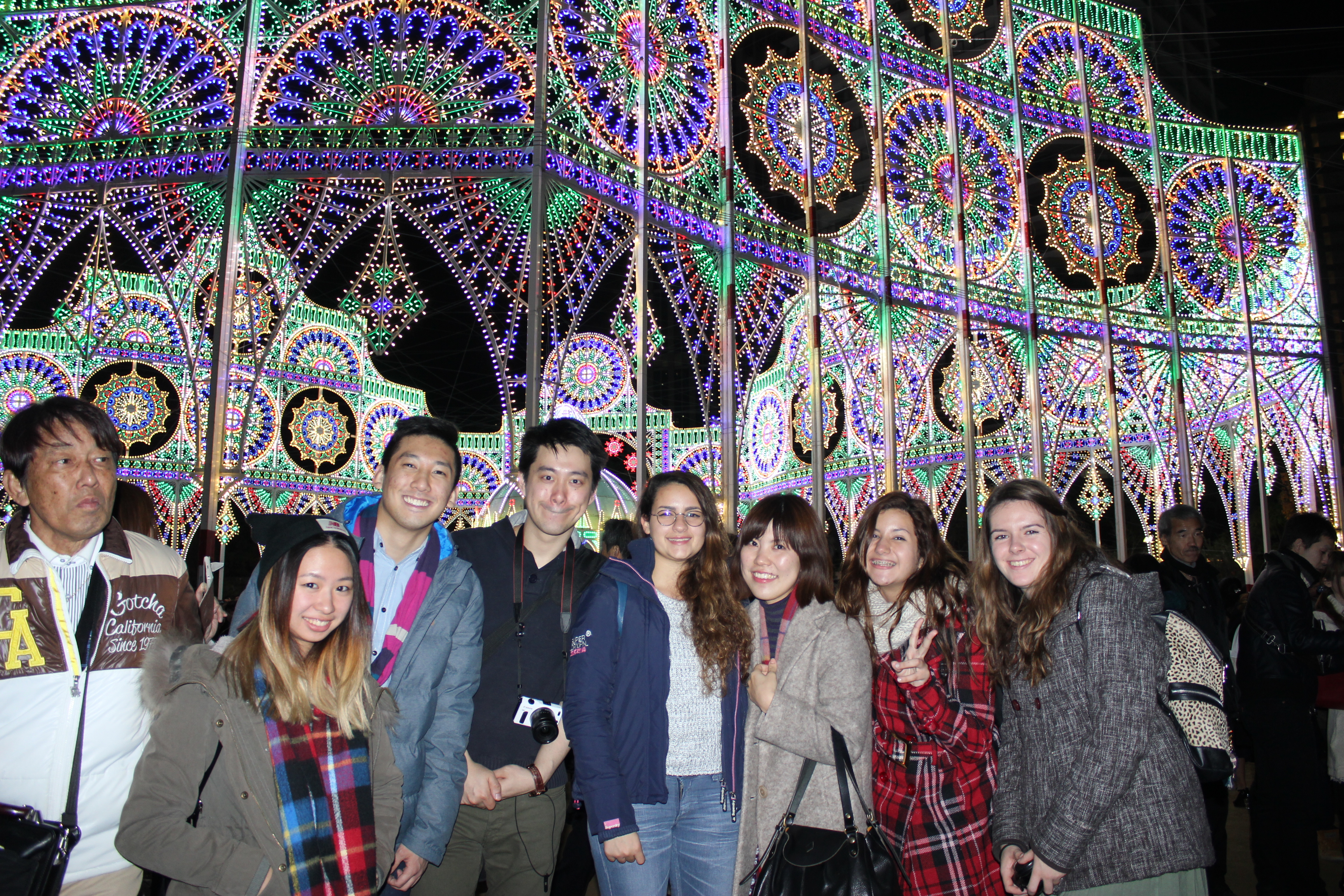 A group of students in front of the lights in Kobe