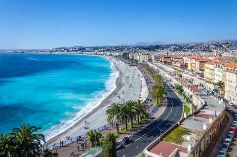 High-angle panoramic view of Nice city with mountains and azure sea in France