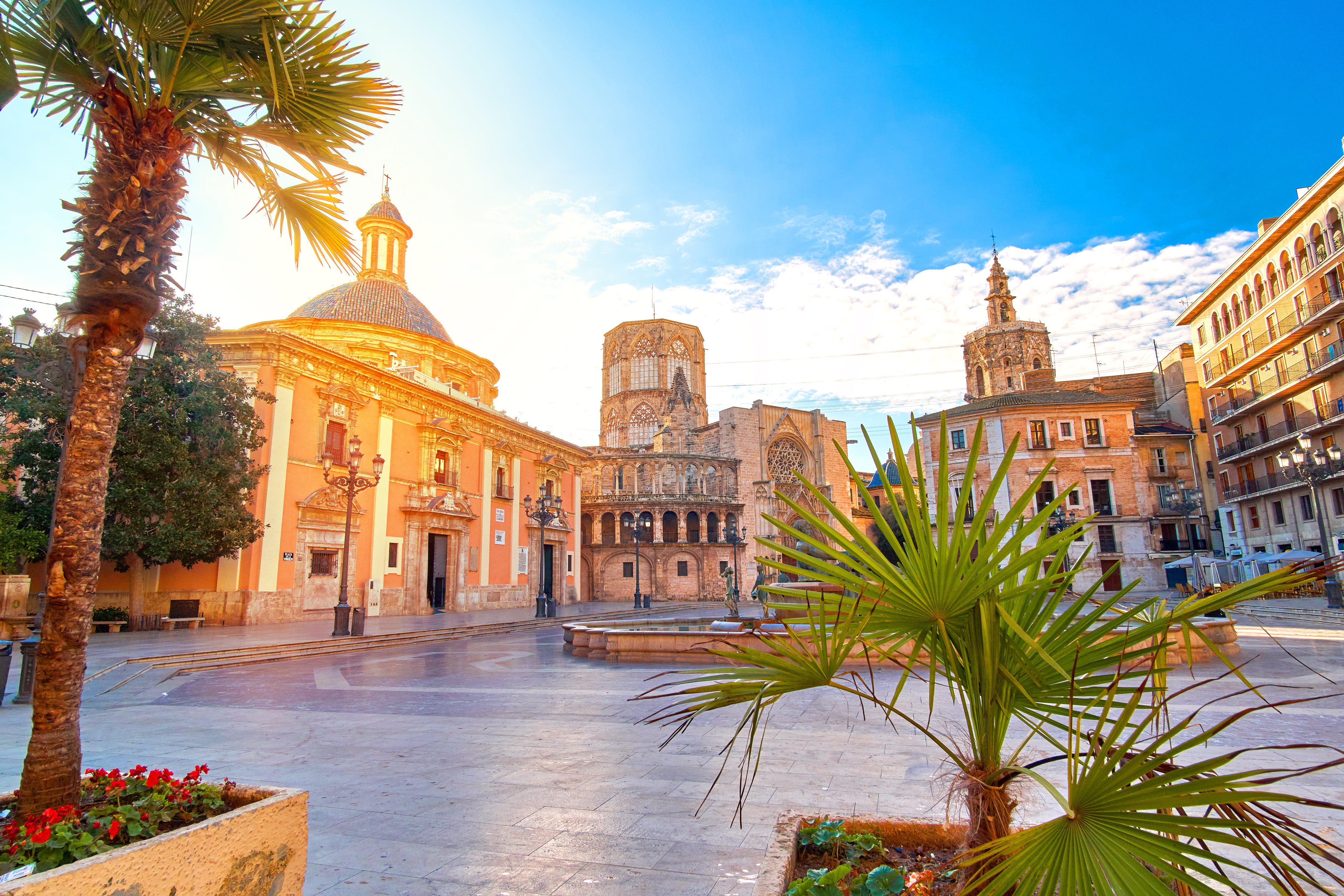 Plaza de la Virgen in Valencia, Spain, featuring the Basilica of the Virgin of the Forsaken, Valencia Cathedral, and the Palau de la Generalitat Valenciana
