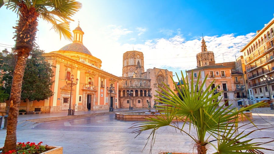 Plaza de la Virgen in Valencia, Spain, featuring the Basilica of the Virgin of the Forsaken, Valencia Cathedral, and the Palau de la Generalitat Valenciana