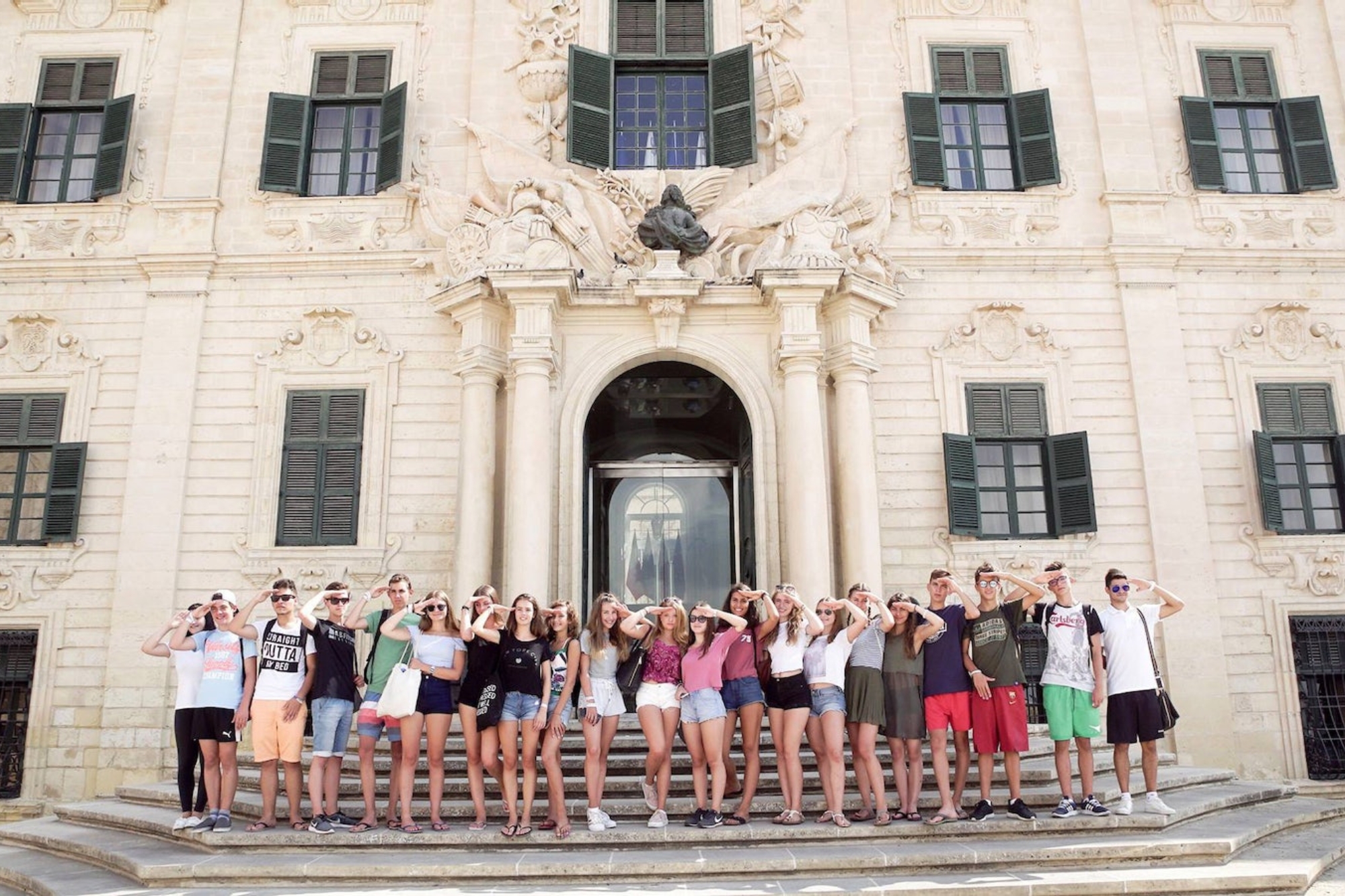 Students posing in front of a building in Malta