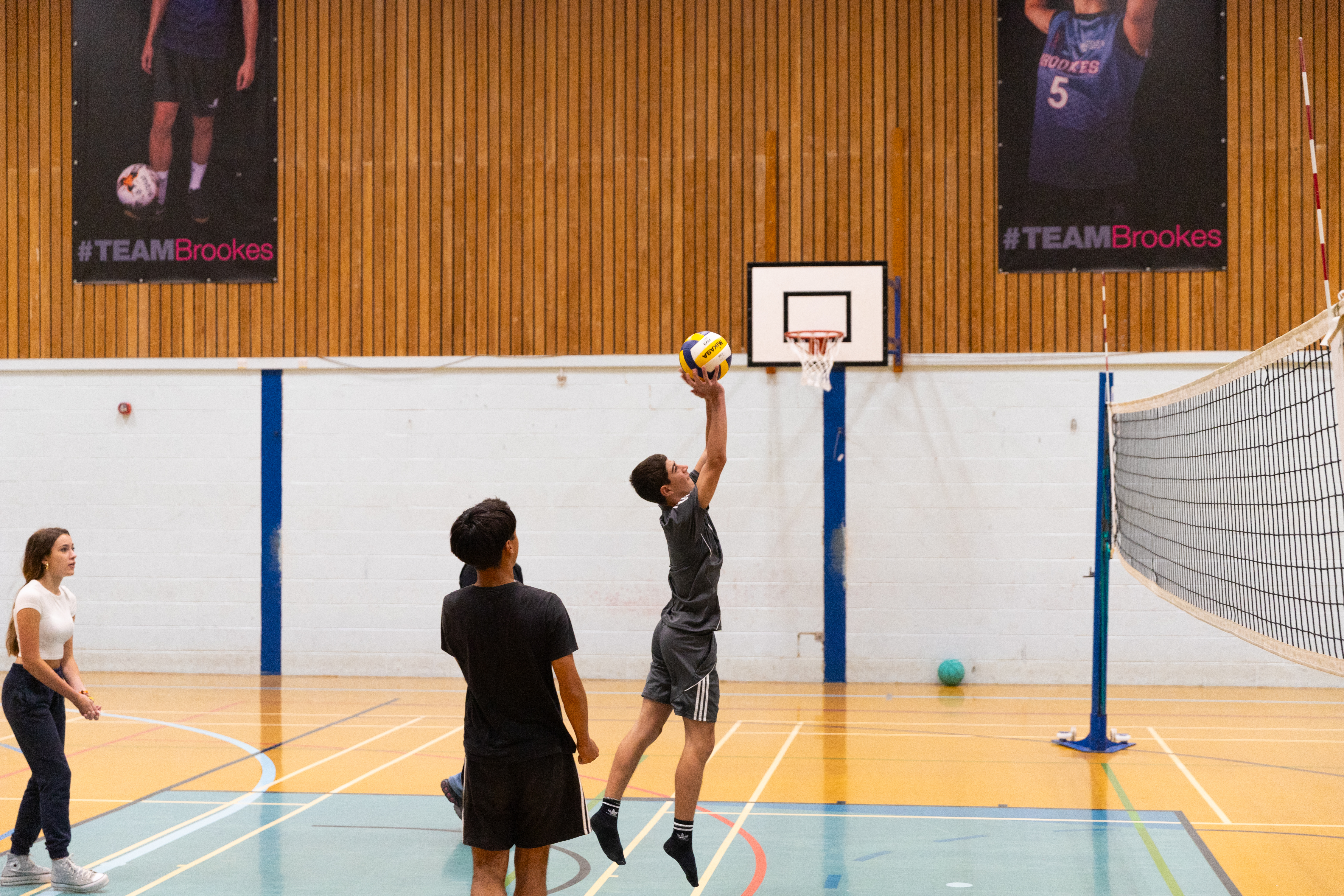 Students playing basketball at Oxford Brookes University