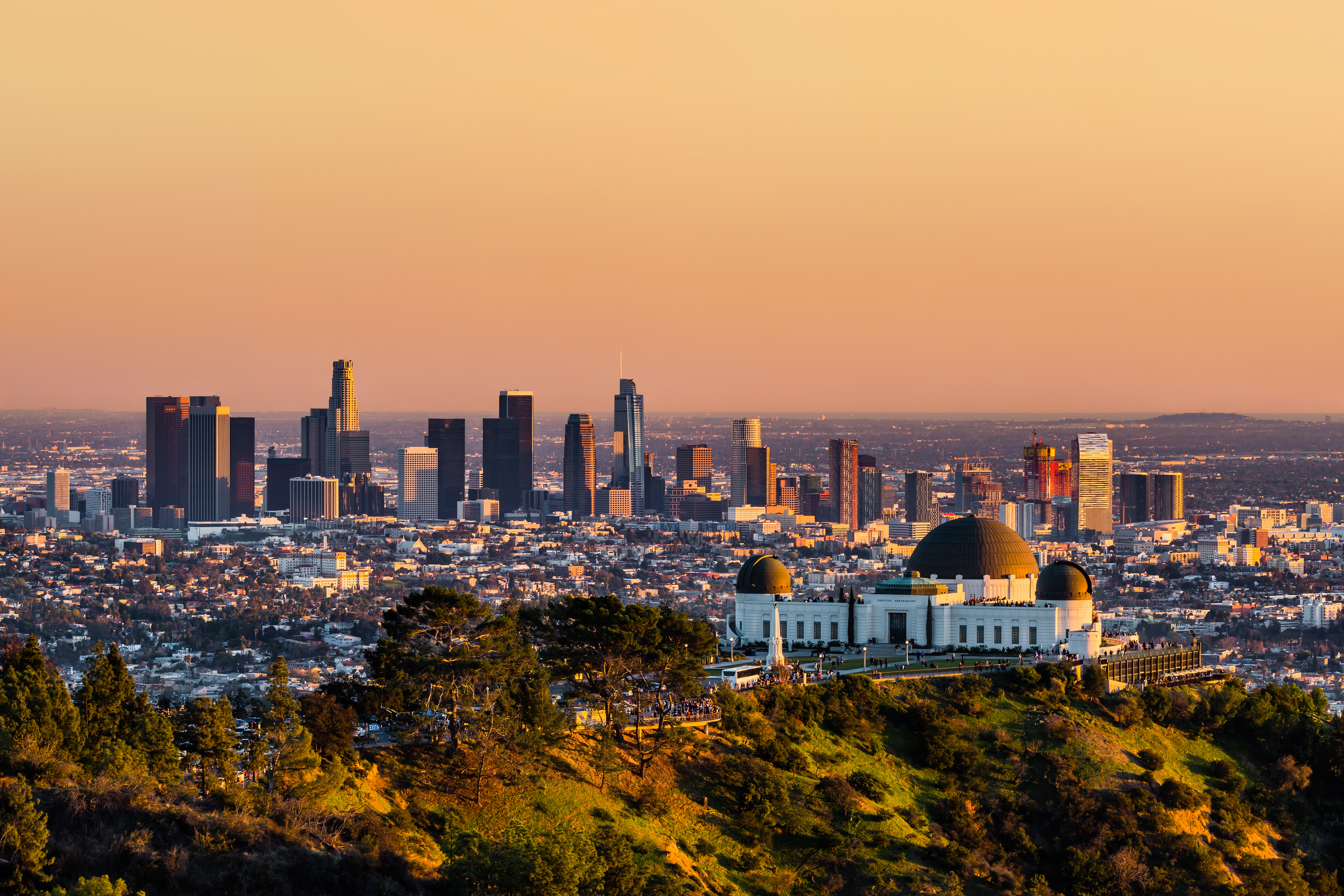 Los Angeles skyscrapers and Griffith Observatory at sunset