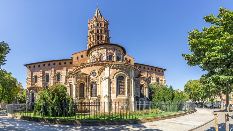 Basilica of Saint-Sernin in Toulouse, France, with its impressive Romanesque architecture with intricate stone details and towering spires