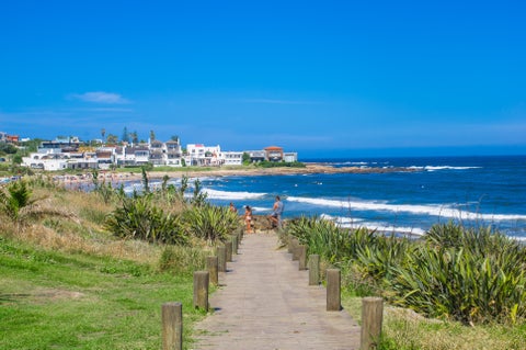 Path leading to Pocitos Beach in Montevideo, Uruguay, with city life and beachfront promenade