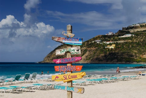 Sign Destinations at a white-sand beach in Barbados South Coast