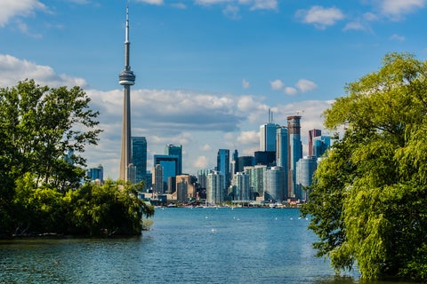 Toronto skyline featuring the iconic CN Tower standing tall among modern skyscrapers