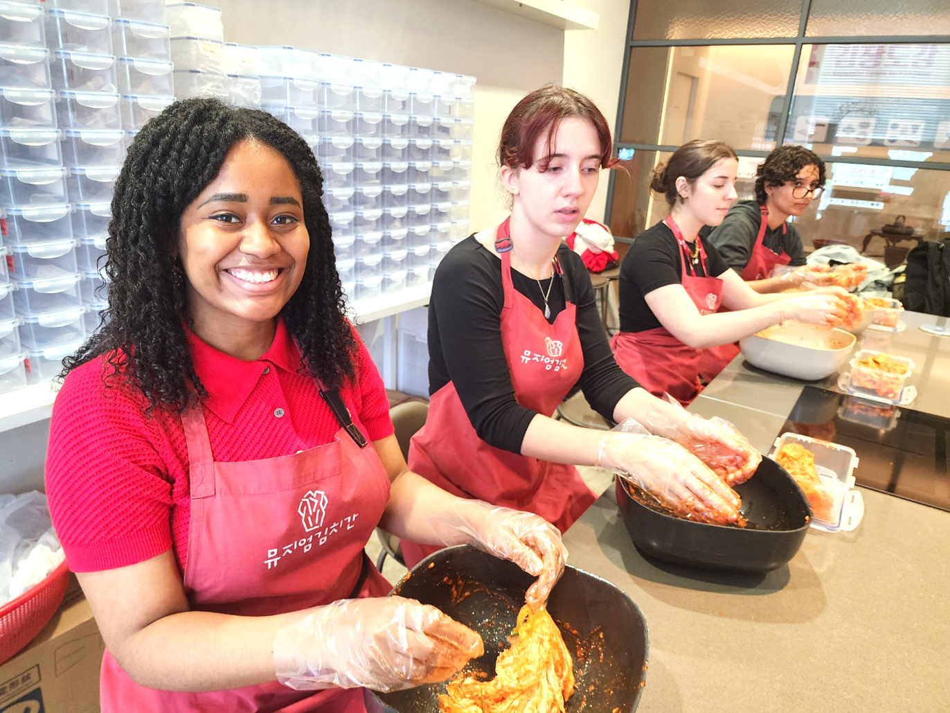 A group of students making kimchi