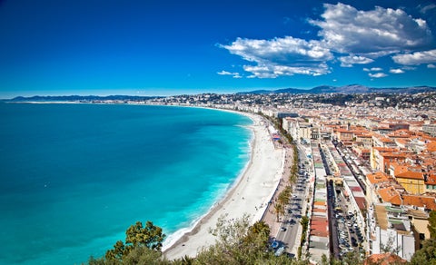 Panoramic high-angle view of Nice city with mountains and Mediterranean Sea in France