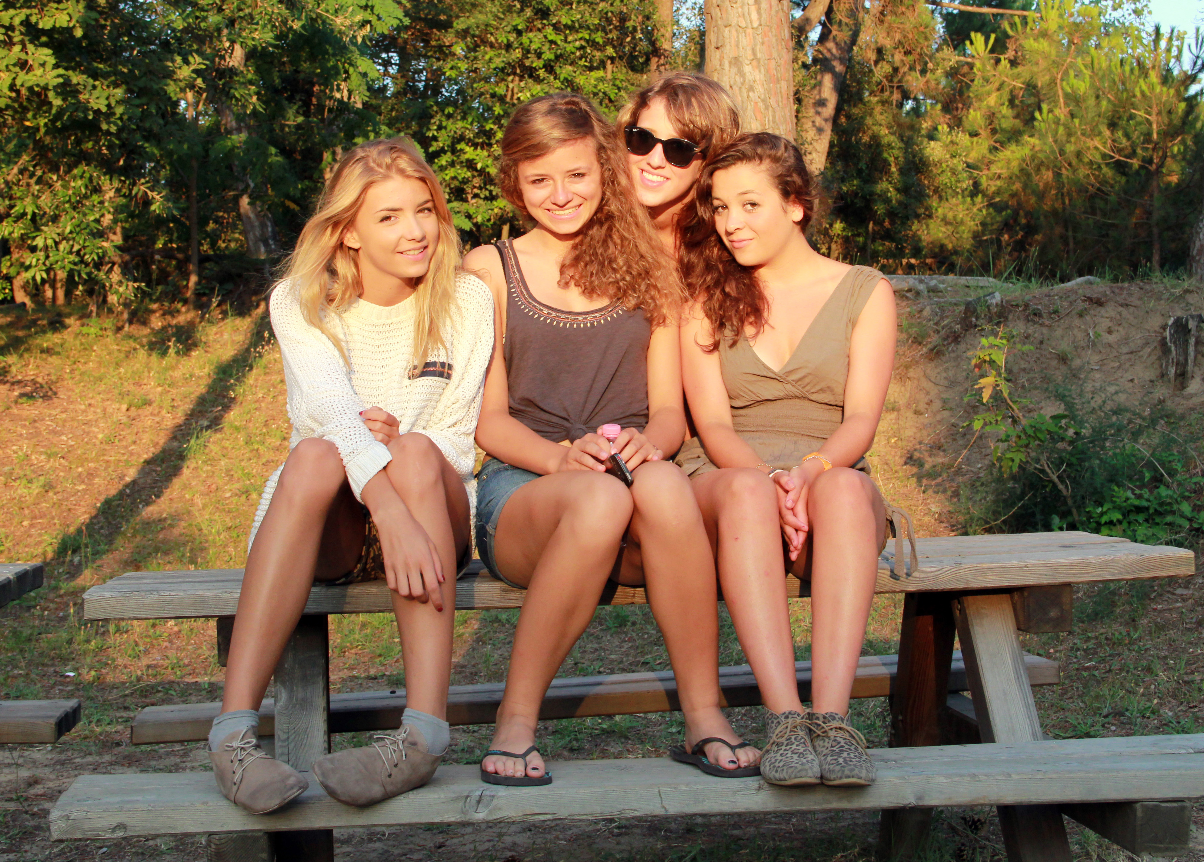 Four students on a picnic table