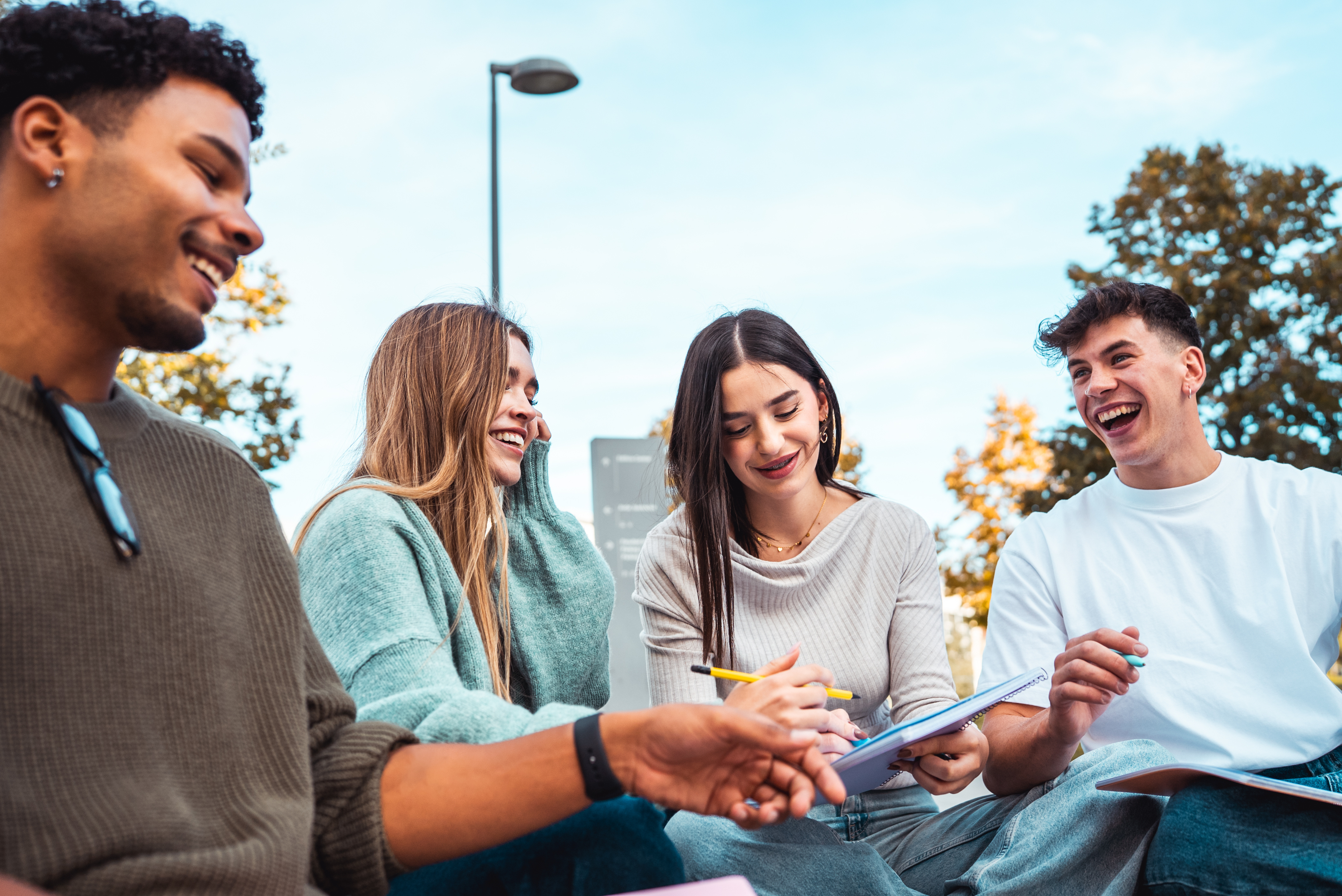 Diverse group of four young college students