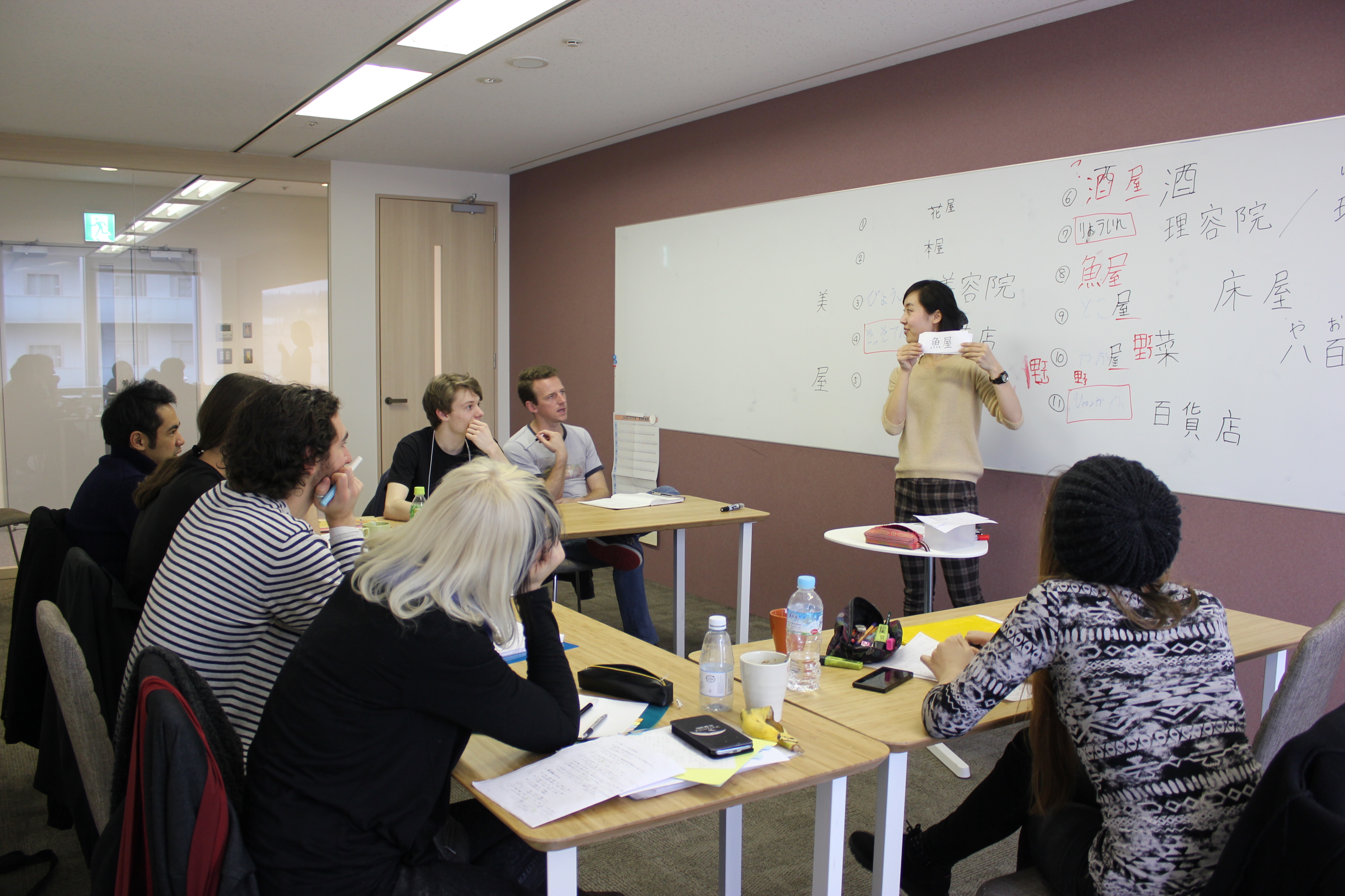 A group of students in class with their teacher