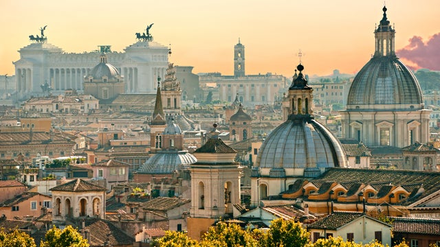 Aerial view of Roma with its iconic landmarks, ancient ruins, and bustling streets