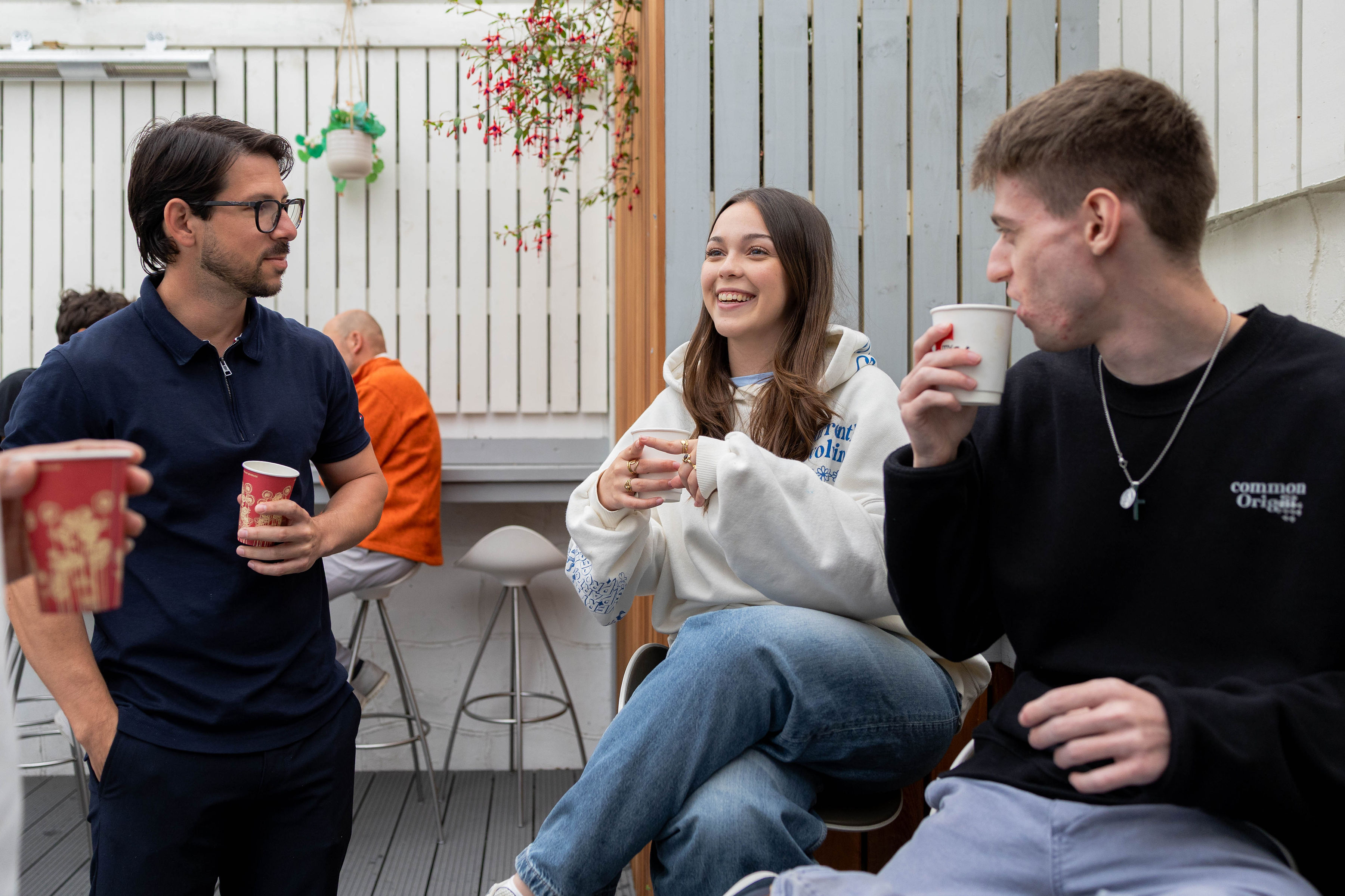 Students having coffee on the school patio