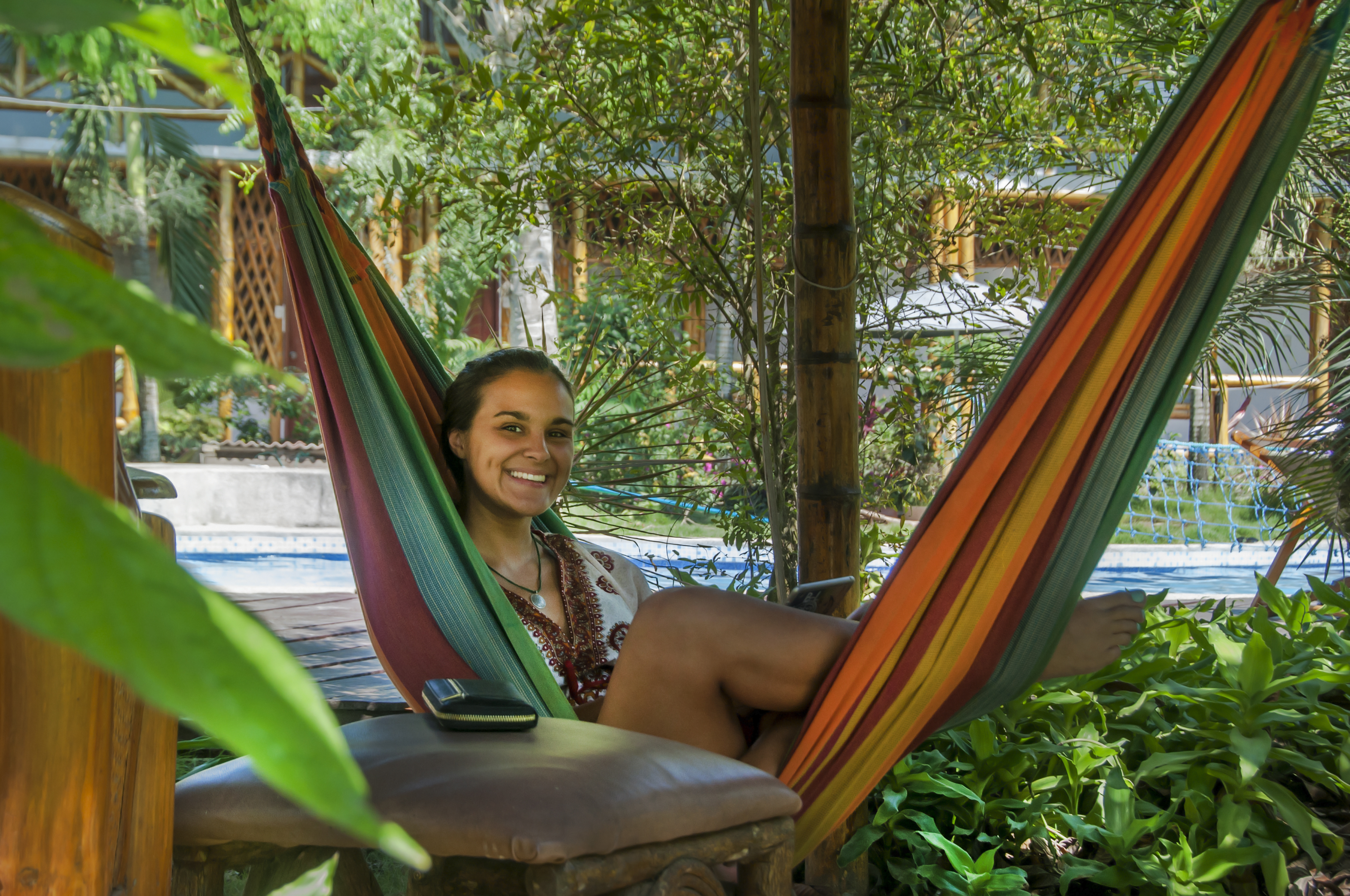 A student lounging on a hammock