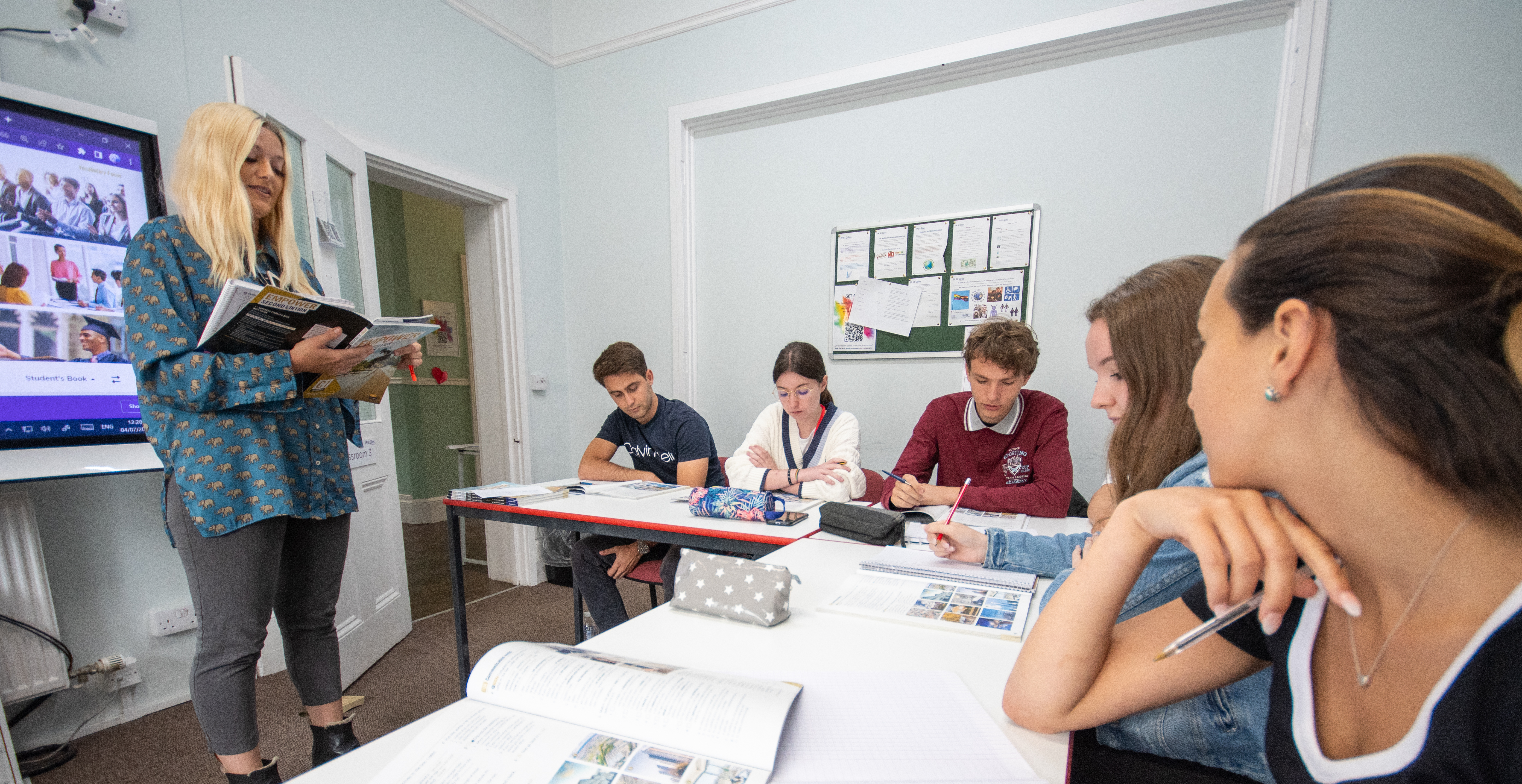 A teacher giving a lesson at Cambridge College Programme