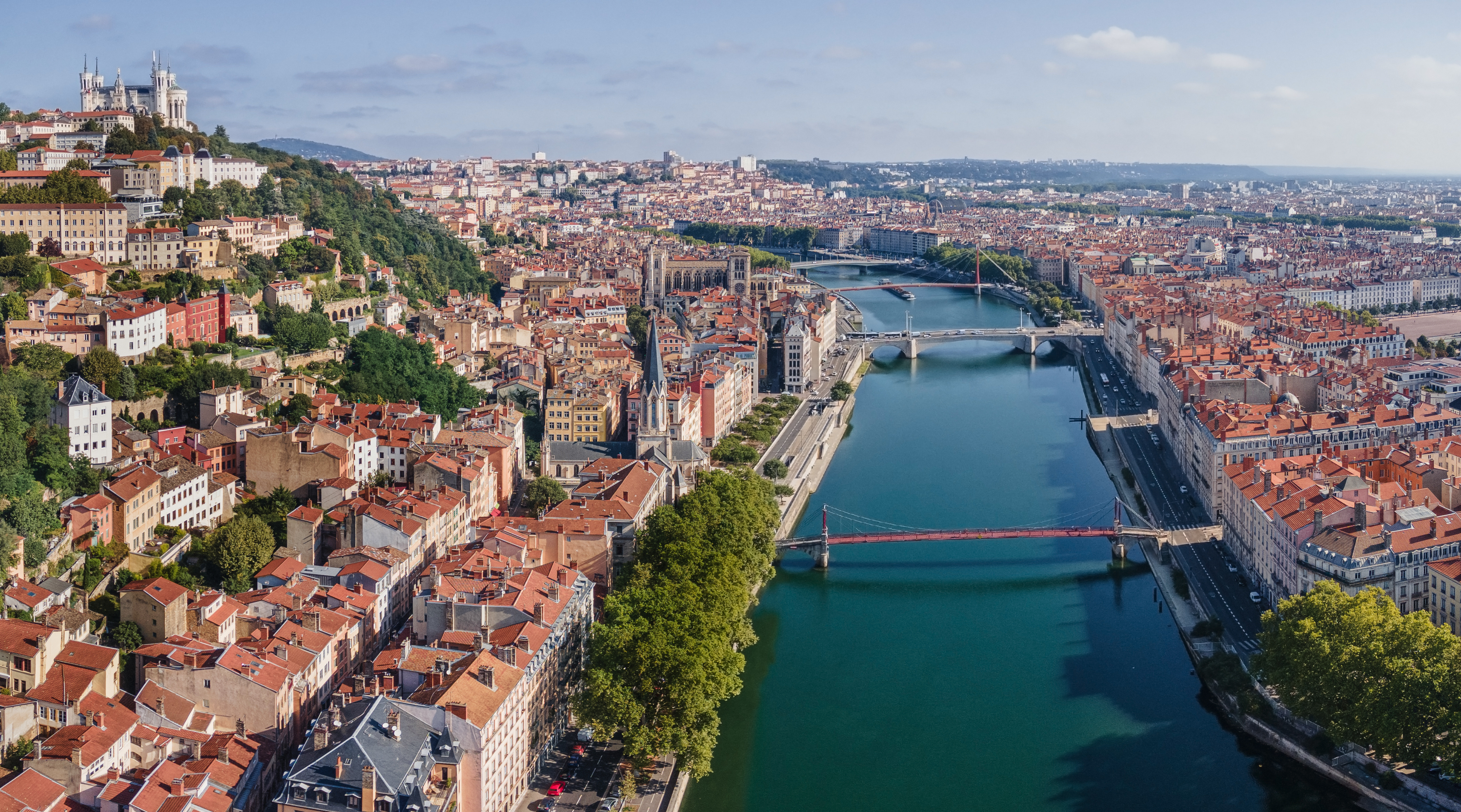 Aerial View of Lyon city with its blend of historic and modern architecture, featuring the Rhône and Saône rivers