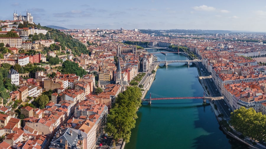 Aerial View of Lyon city with its blend of historic and modern architecture, featuring the Rhône and Saône rivers