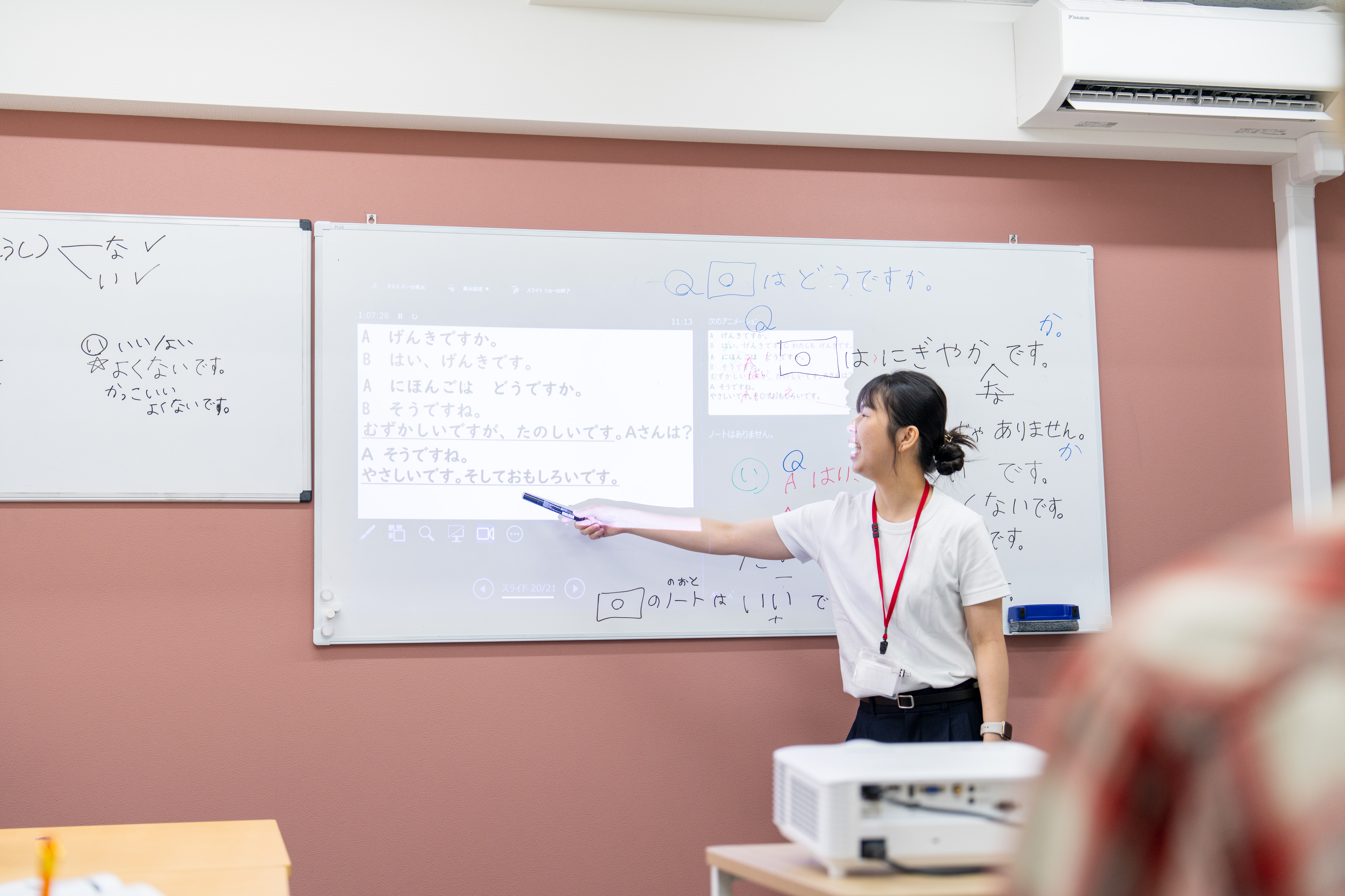 A teacher writing on the white board at Genki Nagoya