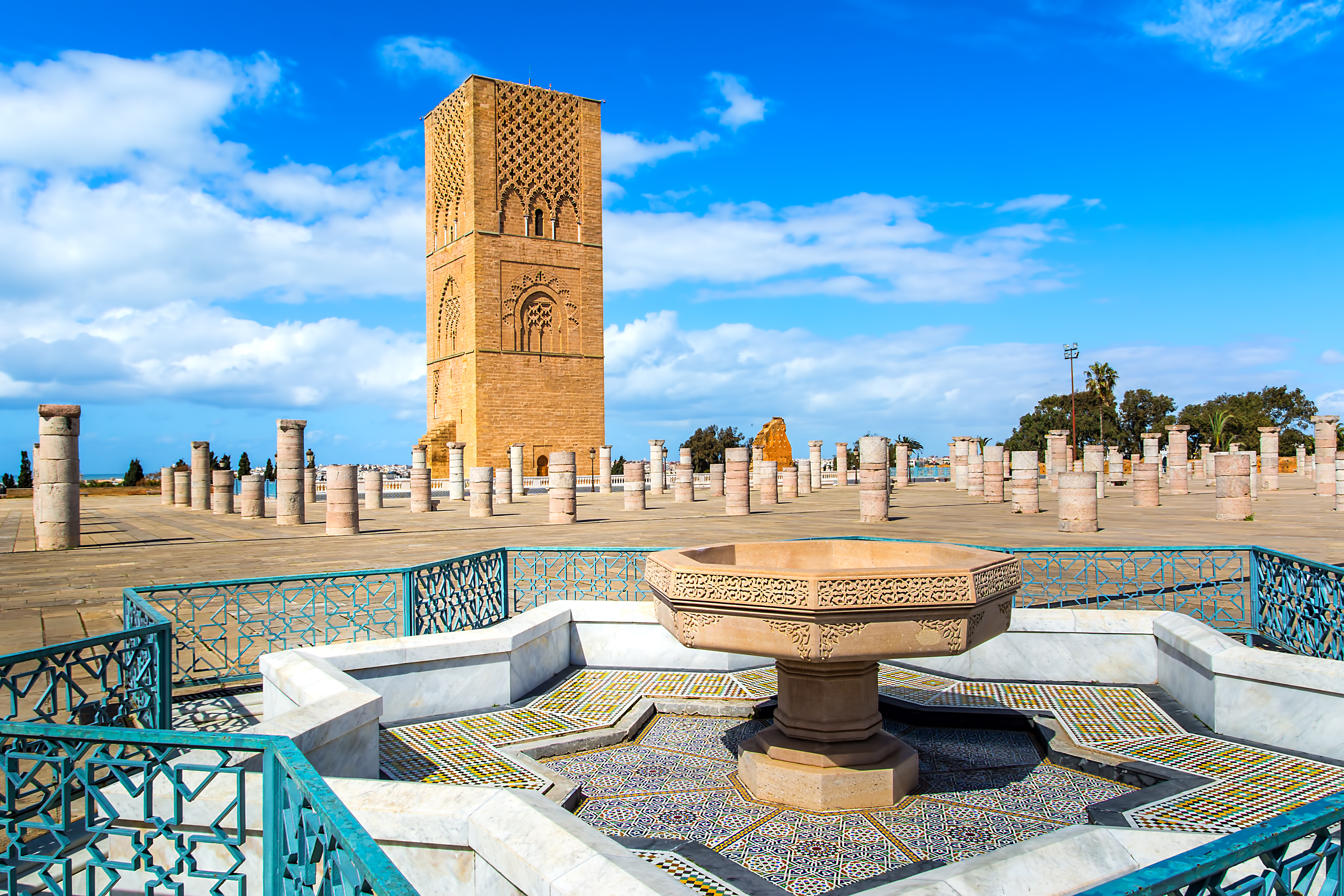 Hassan Tower in Rabat, Morocco, a historic 12th-century red sandstone minaret overlooking the city and Bou Regreg River