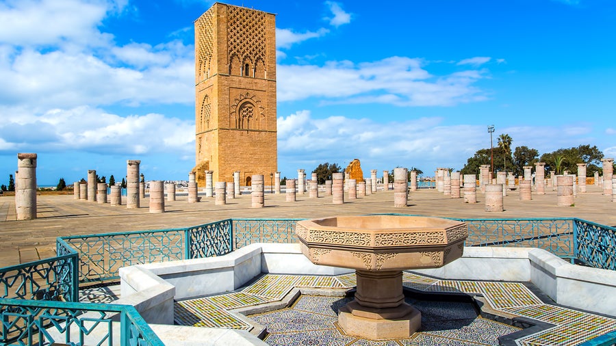 Hassan Tower in Rabat, Morocco, a historic 12th-century red sandstone minaret overlooking the city and Bou Regreg River