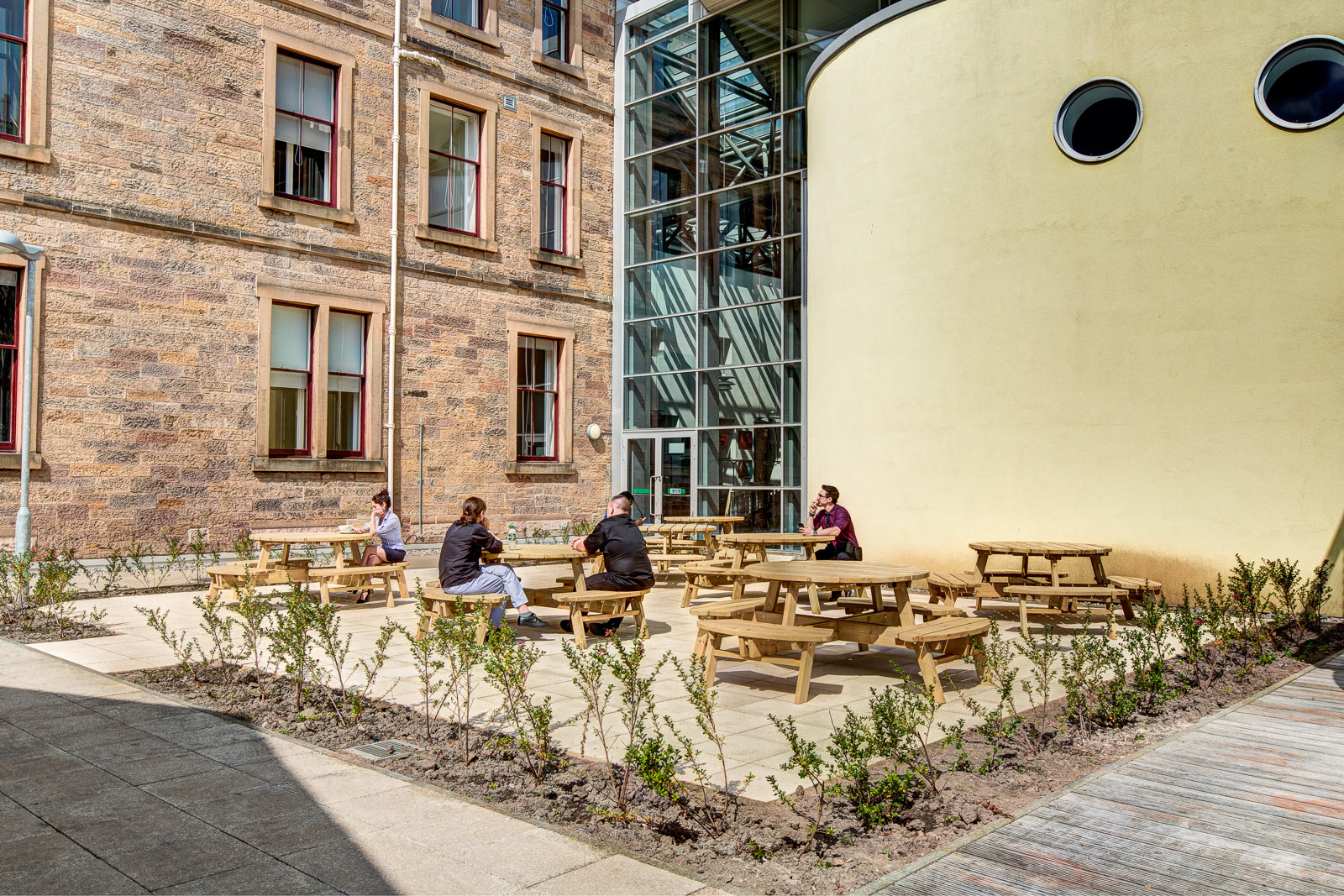 Students sitting at the school patio